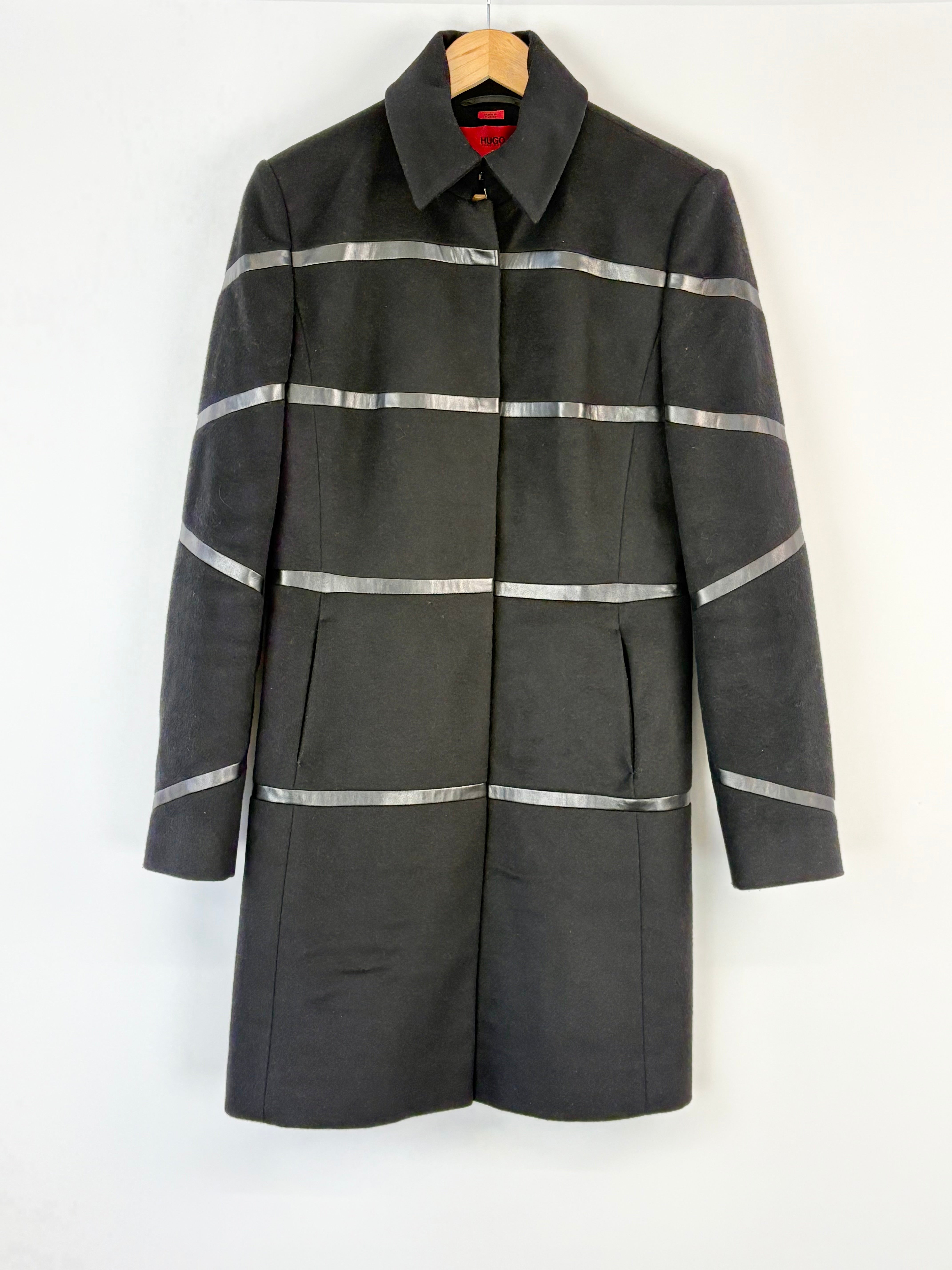 Black coat with reflective stripes on a white background