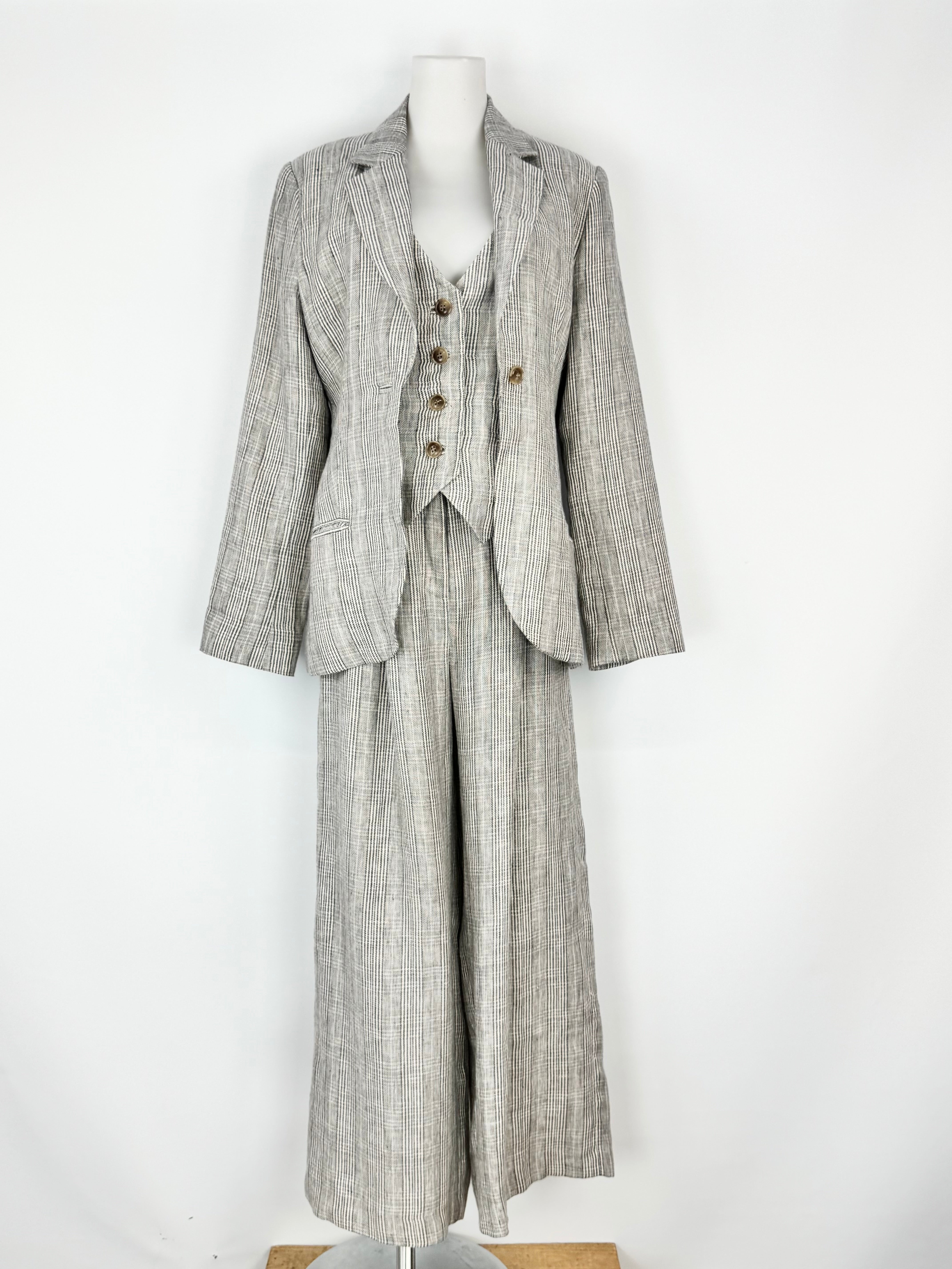 Gray checkered suit on a mannequin against a white background