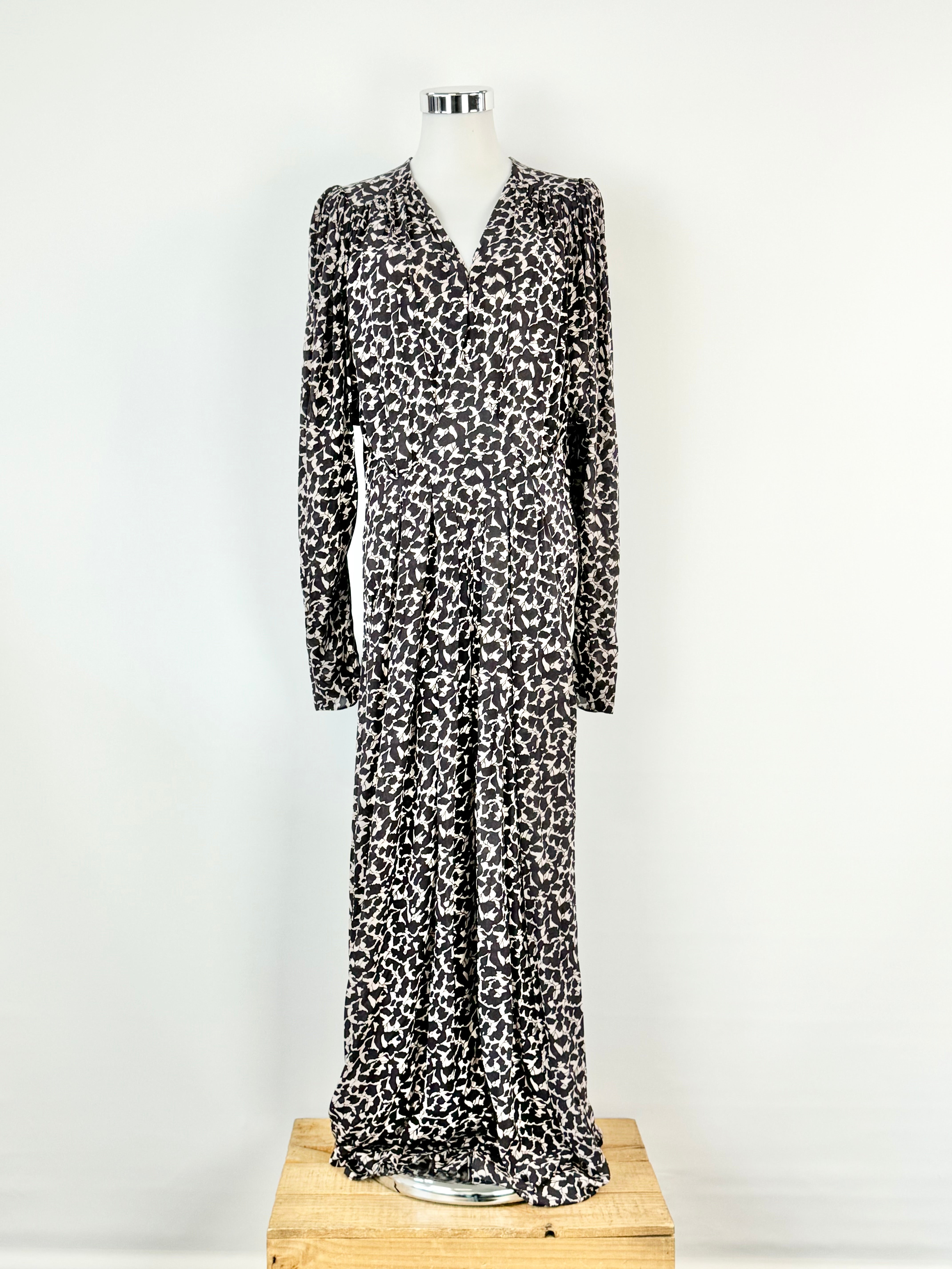 Long sleeve midi dress with an abstract pattern, displayed on a mannequin against a white background.