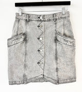 Denim skirt with button details on a white background