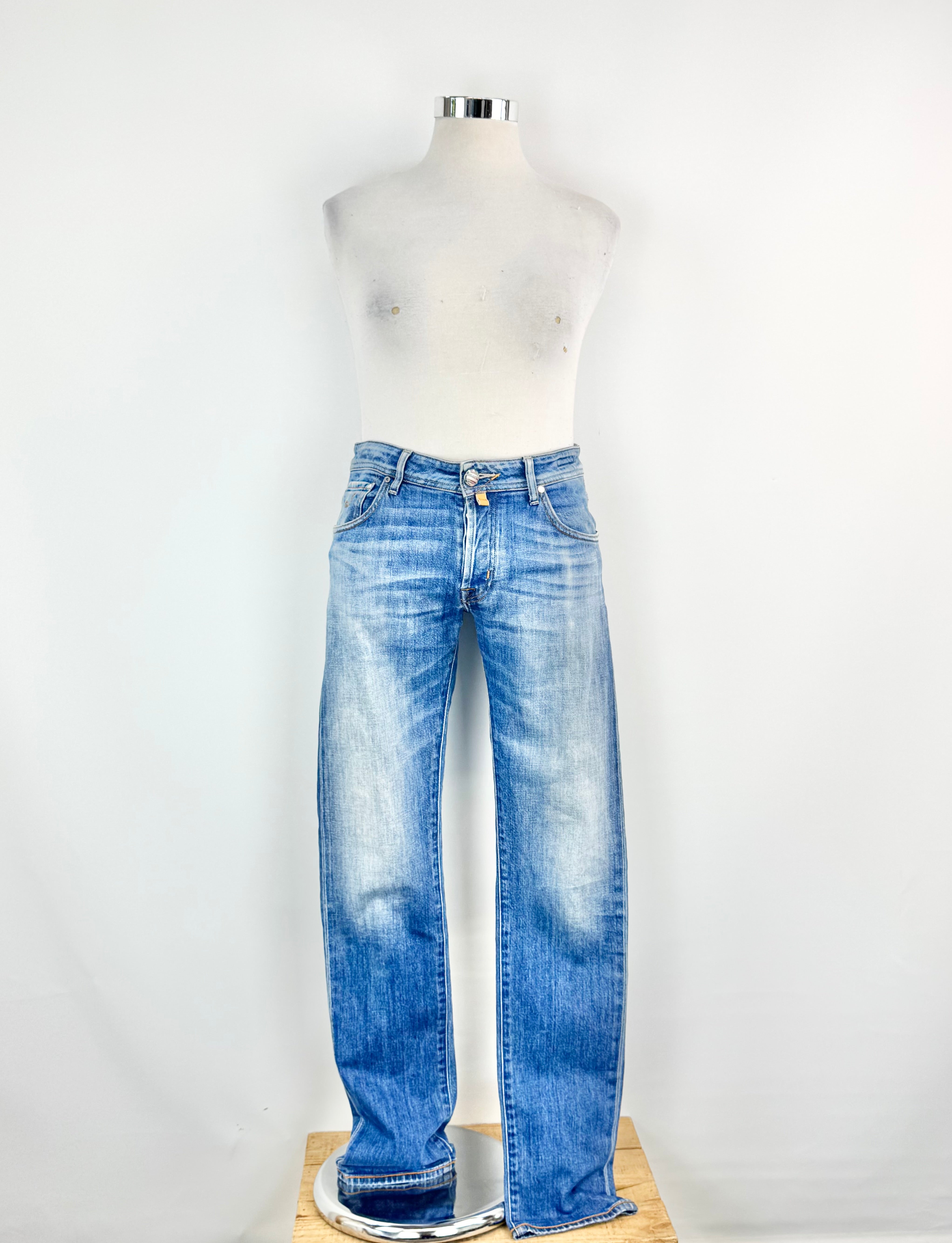 Blue jeans on a mannequin against a white background