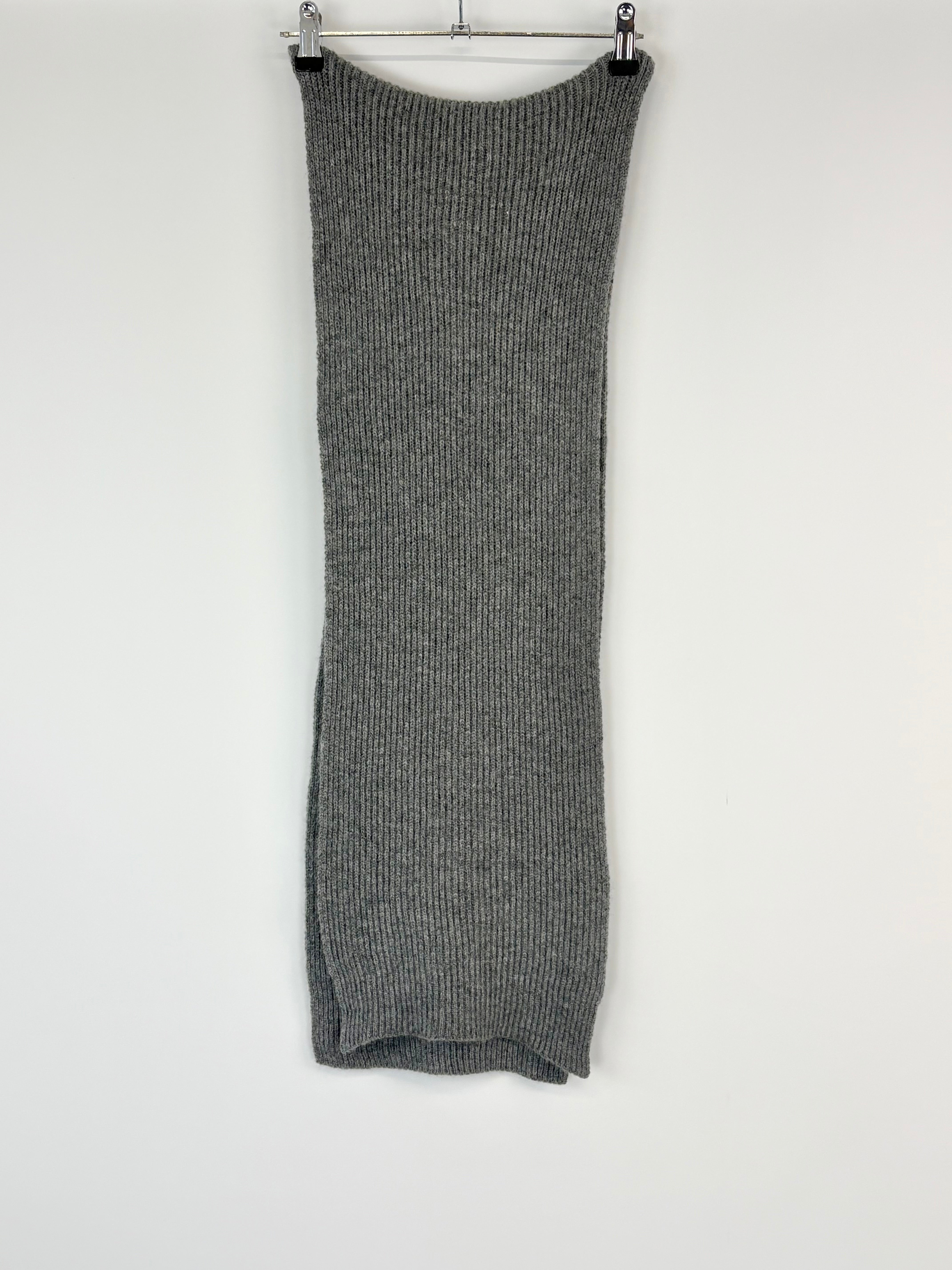 Gray ribbed knit dress on a hanger against a white background