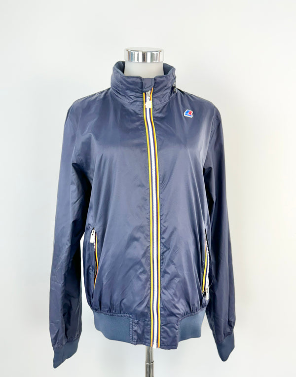 Navy blue nylon jersey jacket with zippered pockets and a hood, displayed on a mannequin.