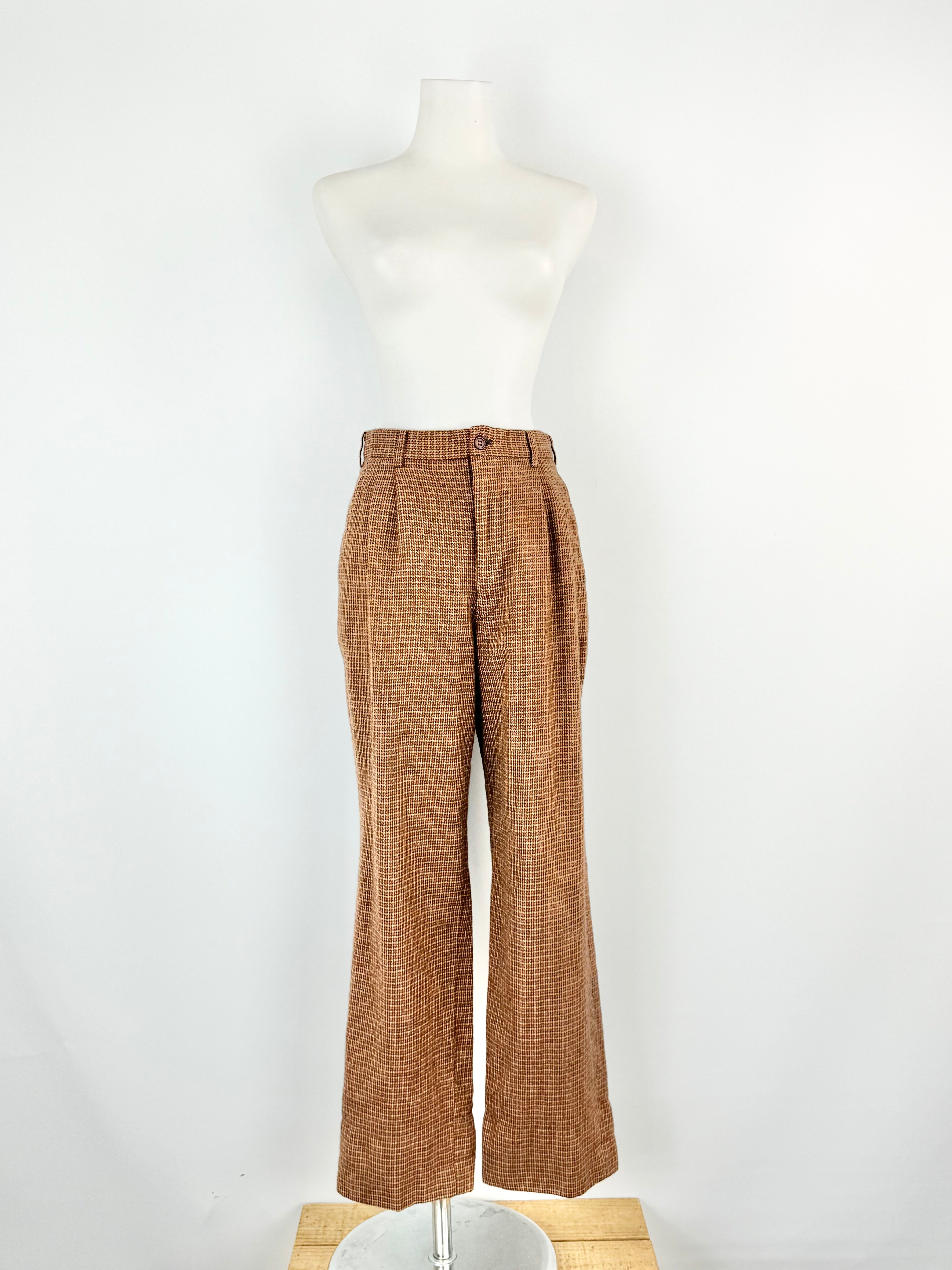 Brown plaid pants on a mannequin against a white background