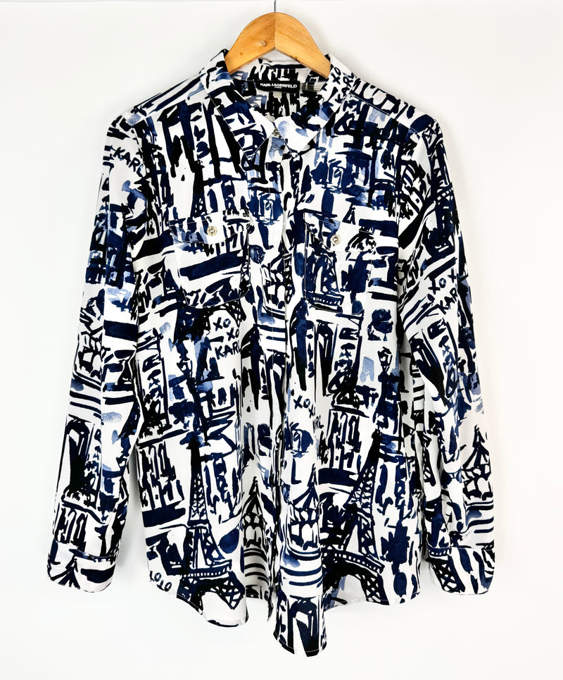 Patterned shirt on a hanger against a white background