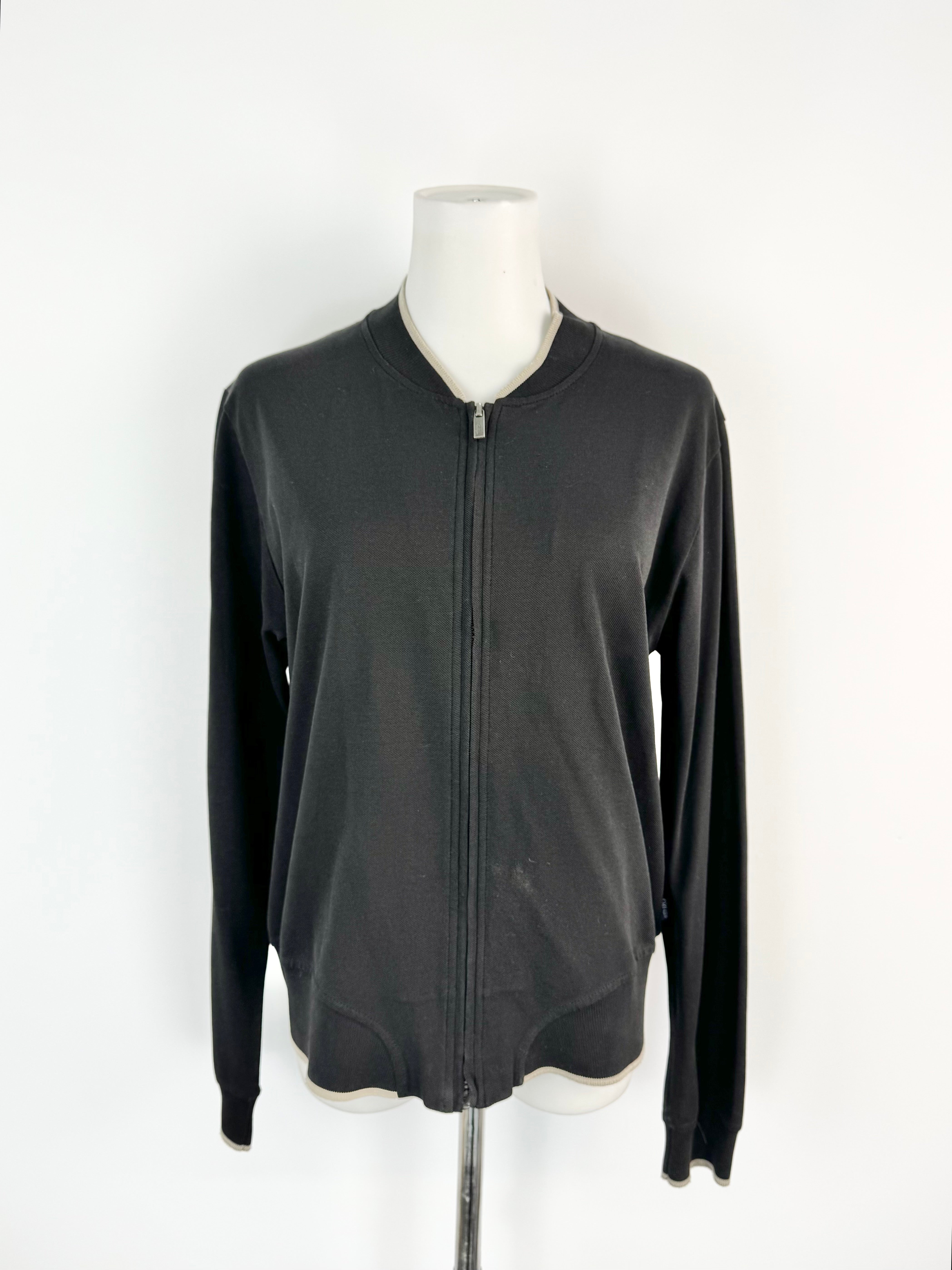 Black zip-up sweatshirt on a mannequin against a white background