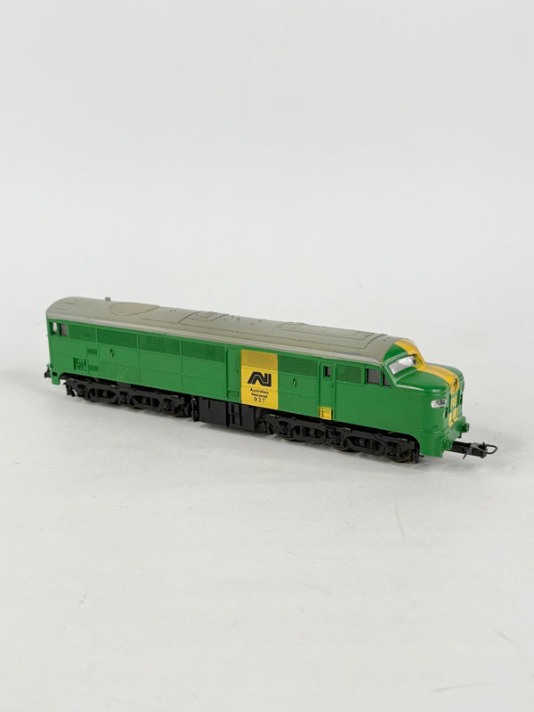 Model train engine in green with a yellow logo on a white background