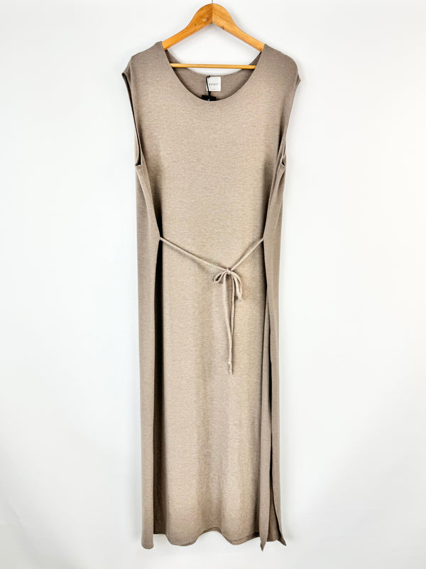 Beige sleeveless dress on a hanger against a white background