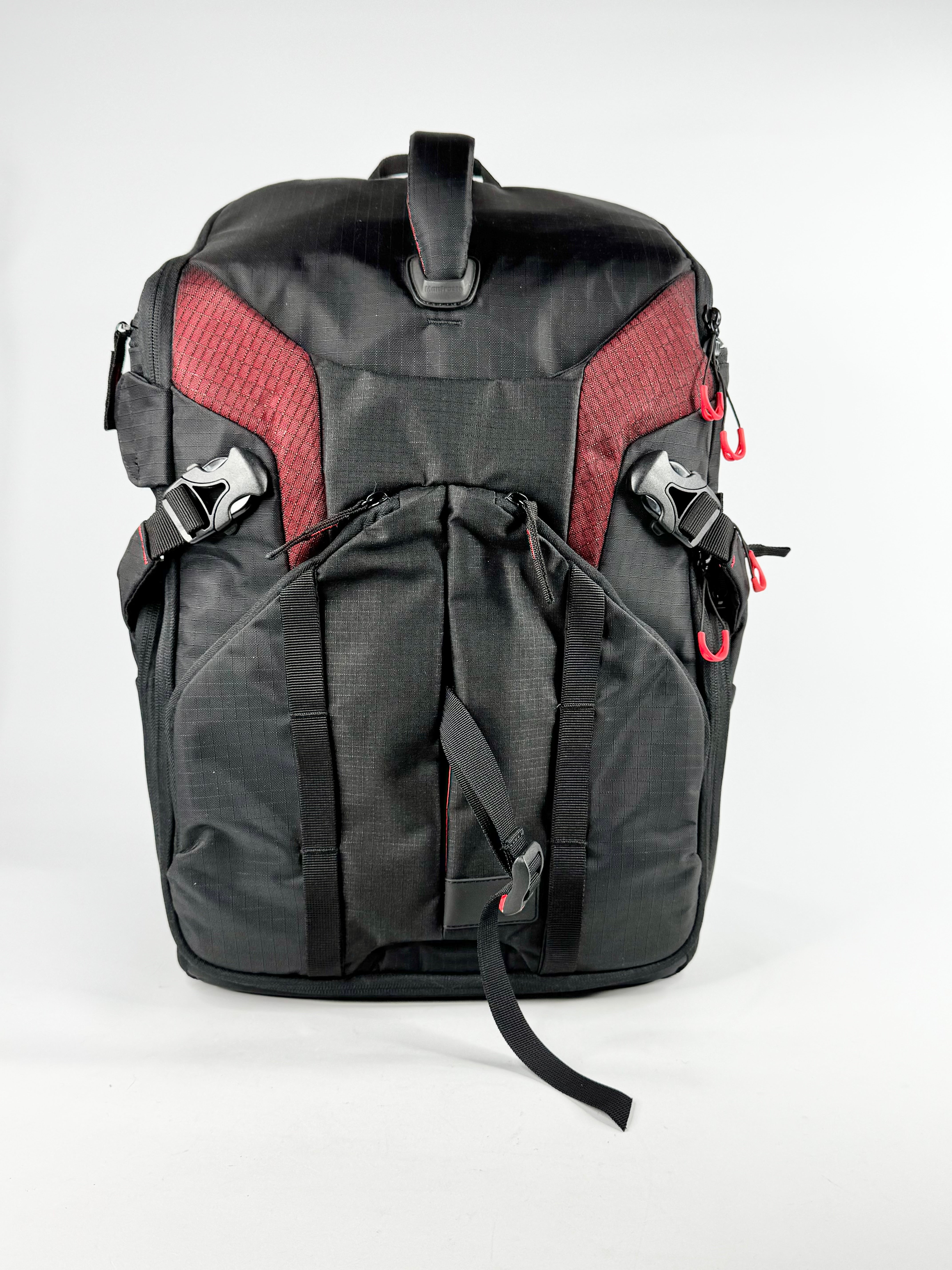 Black and red backpack on a white background
