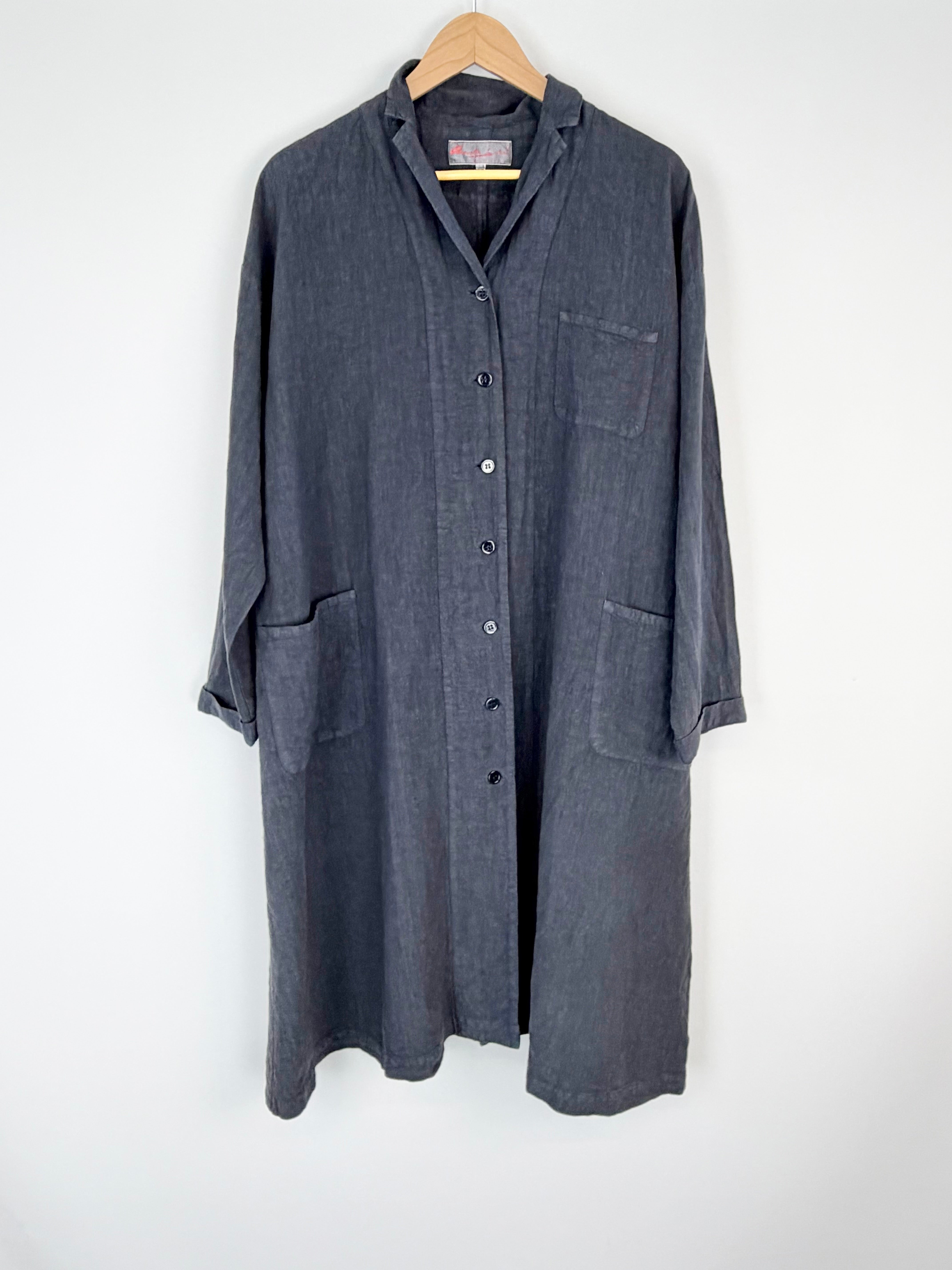 Long dark gray shirt on a hanger against a white background