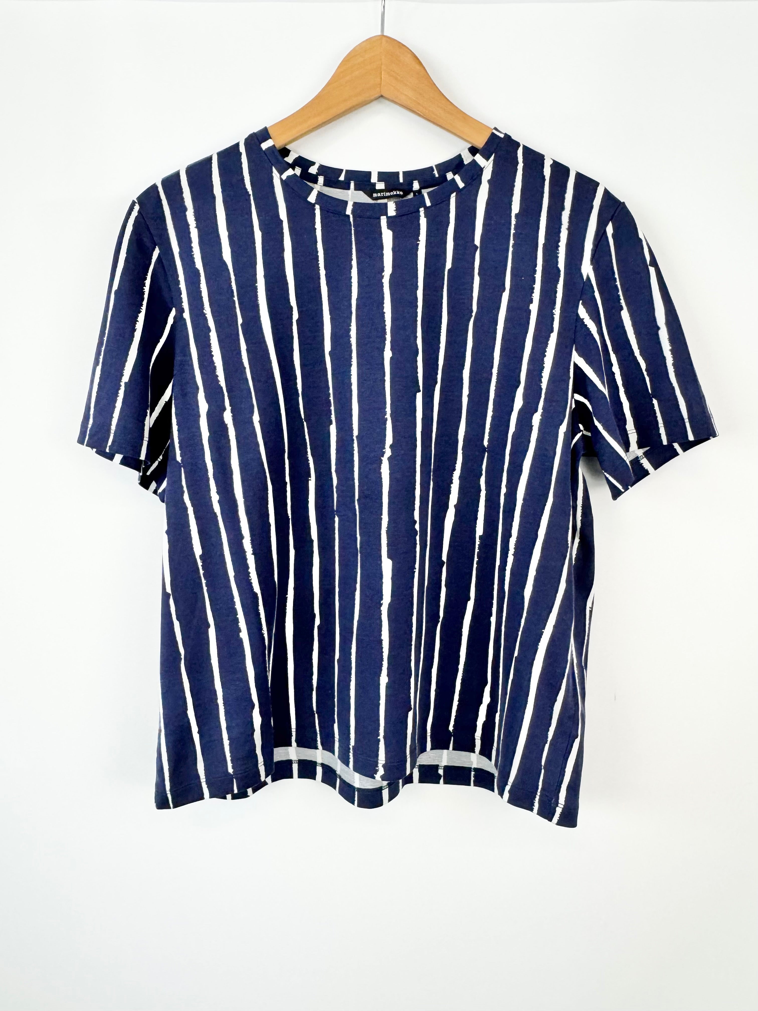 Blue and white striped shirt on a wooden hanger against a white background