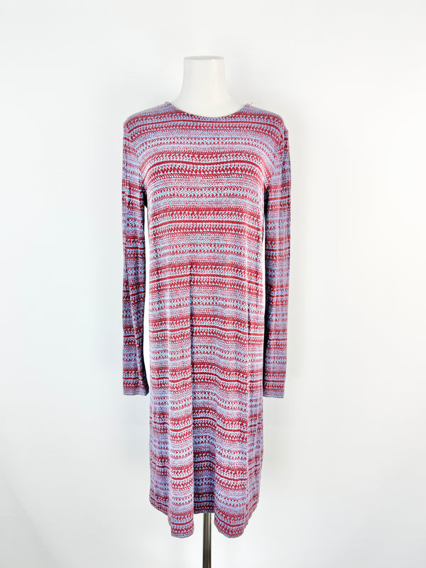 Long-sleeve dress with a pattern on a mannequin against a white background