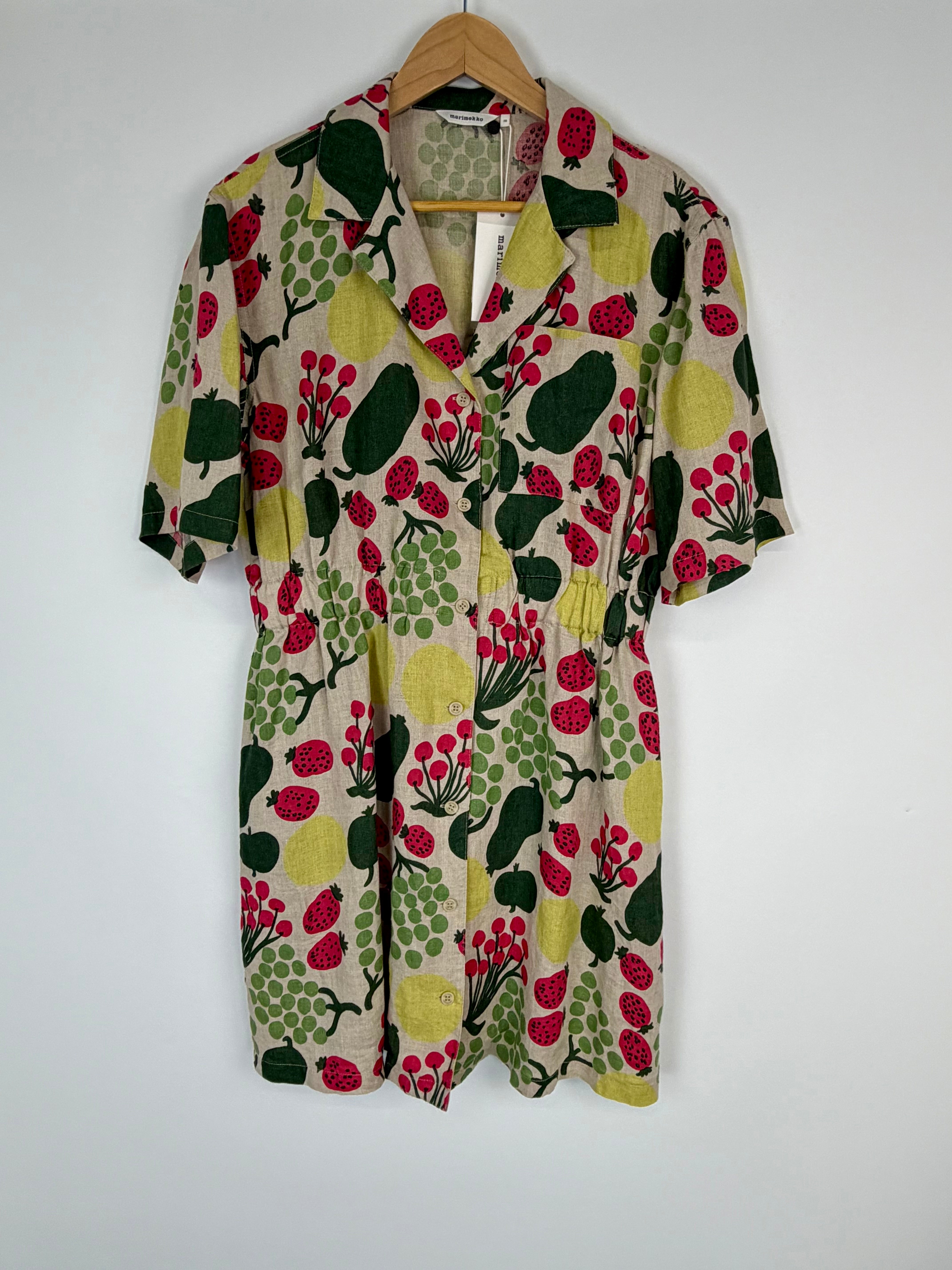 Floral patterned shirt on a hanger against a white background