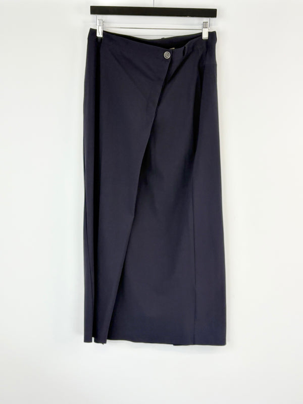 Navy blue skirt on a hanger against a white background