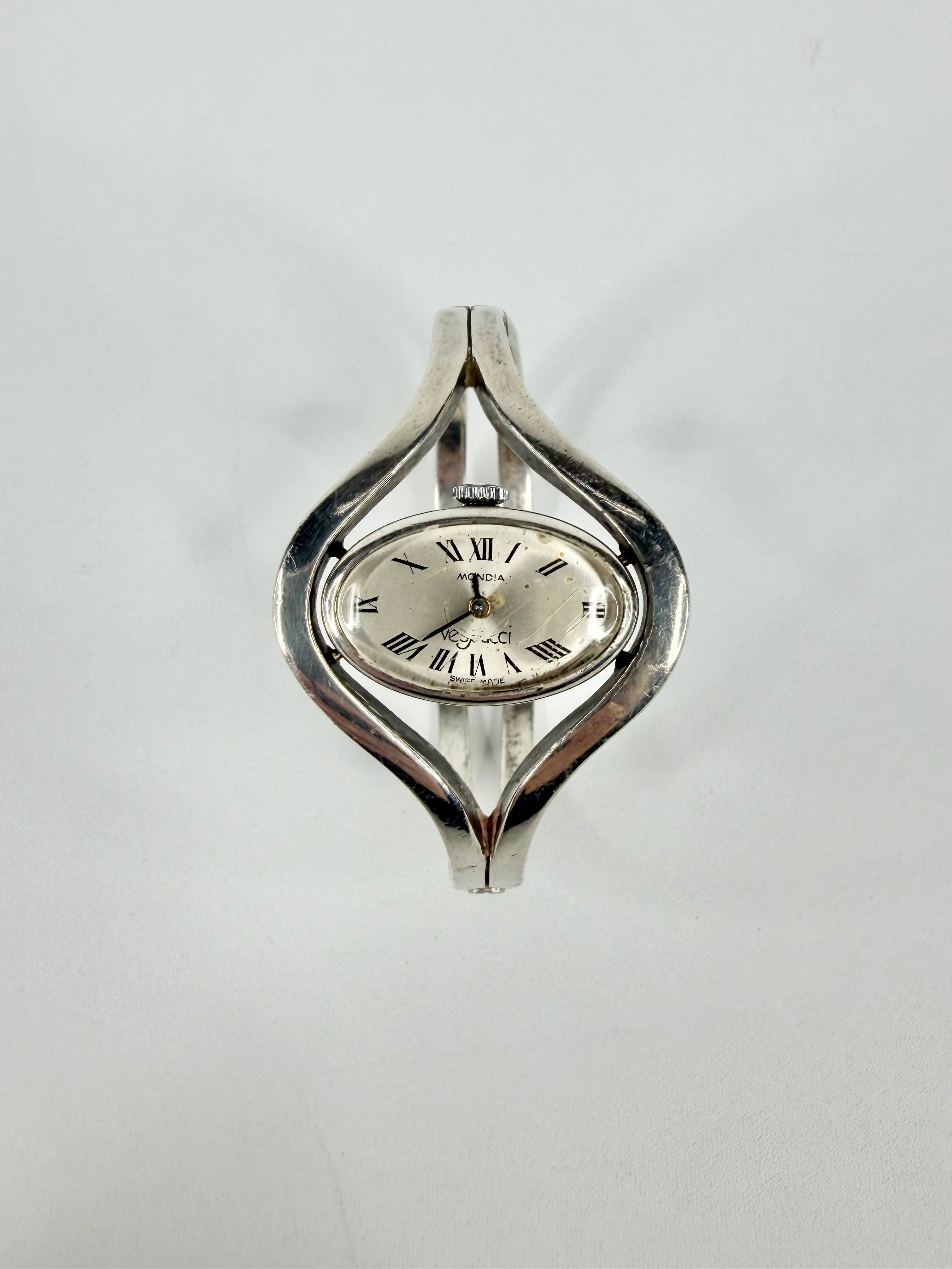 Silver wristwatch with a unique design on a white background