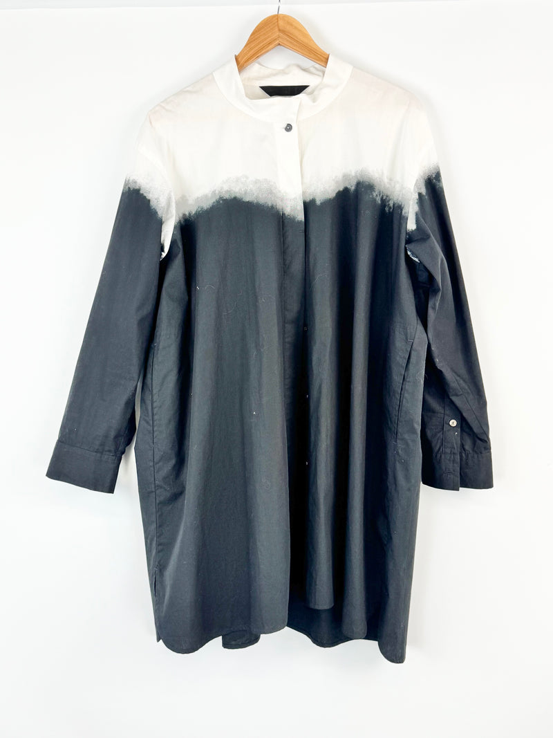 Gray & white coat with white fur trim on a hanger against a white background