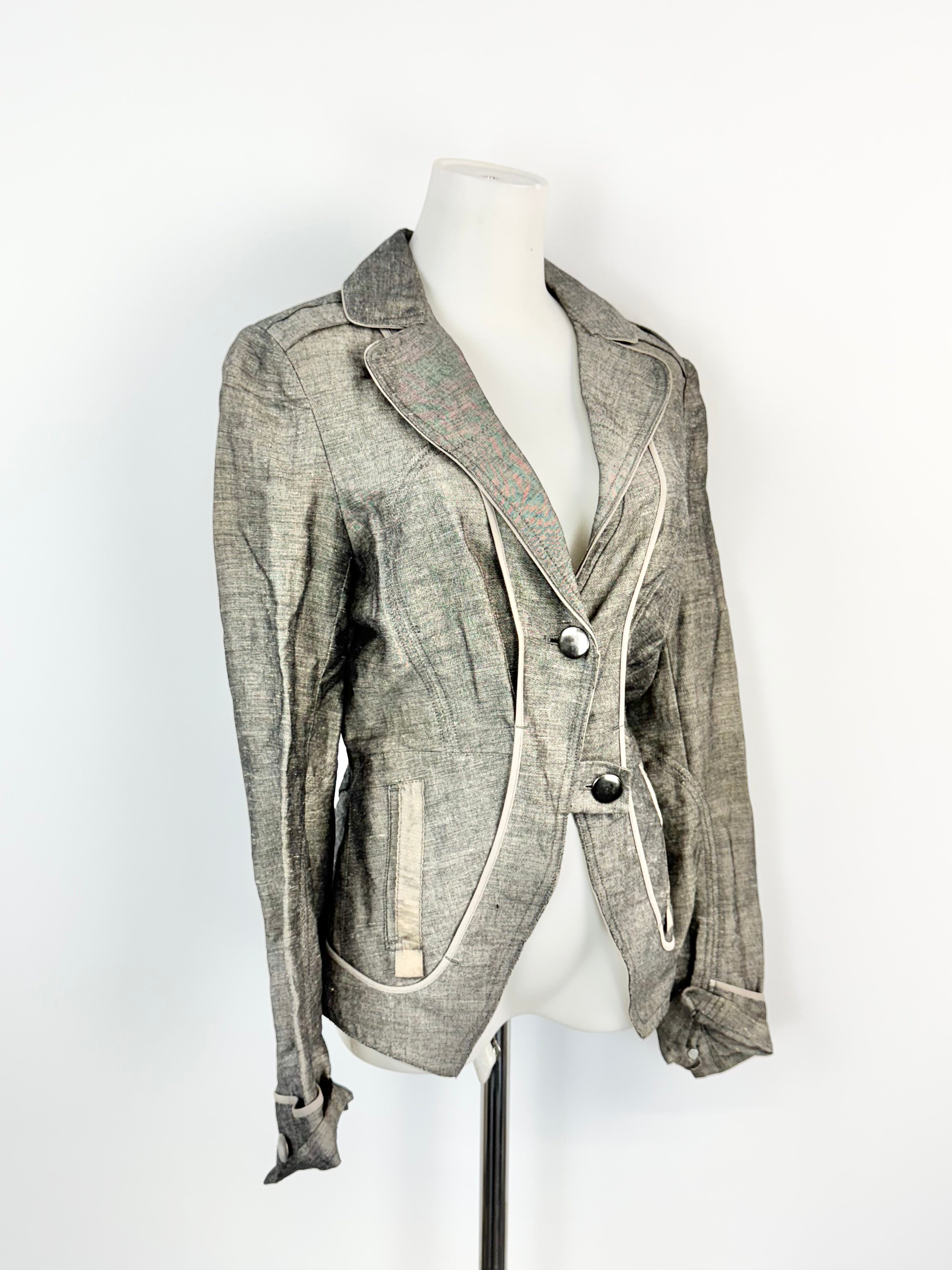 Gray jacket on a mannequin against a white background