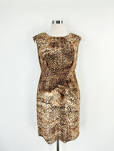 A brown animal patterned midi dress on a mannequin, size AU12/14.