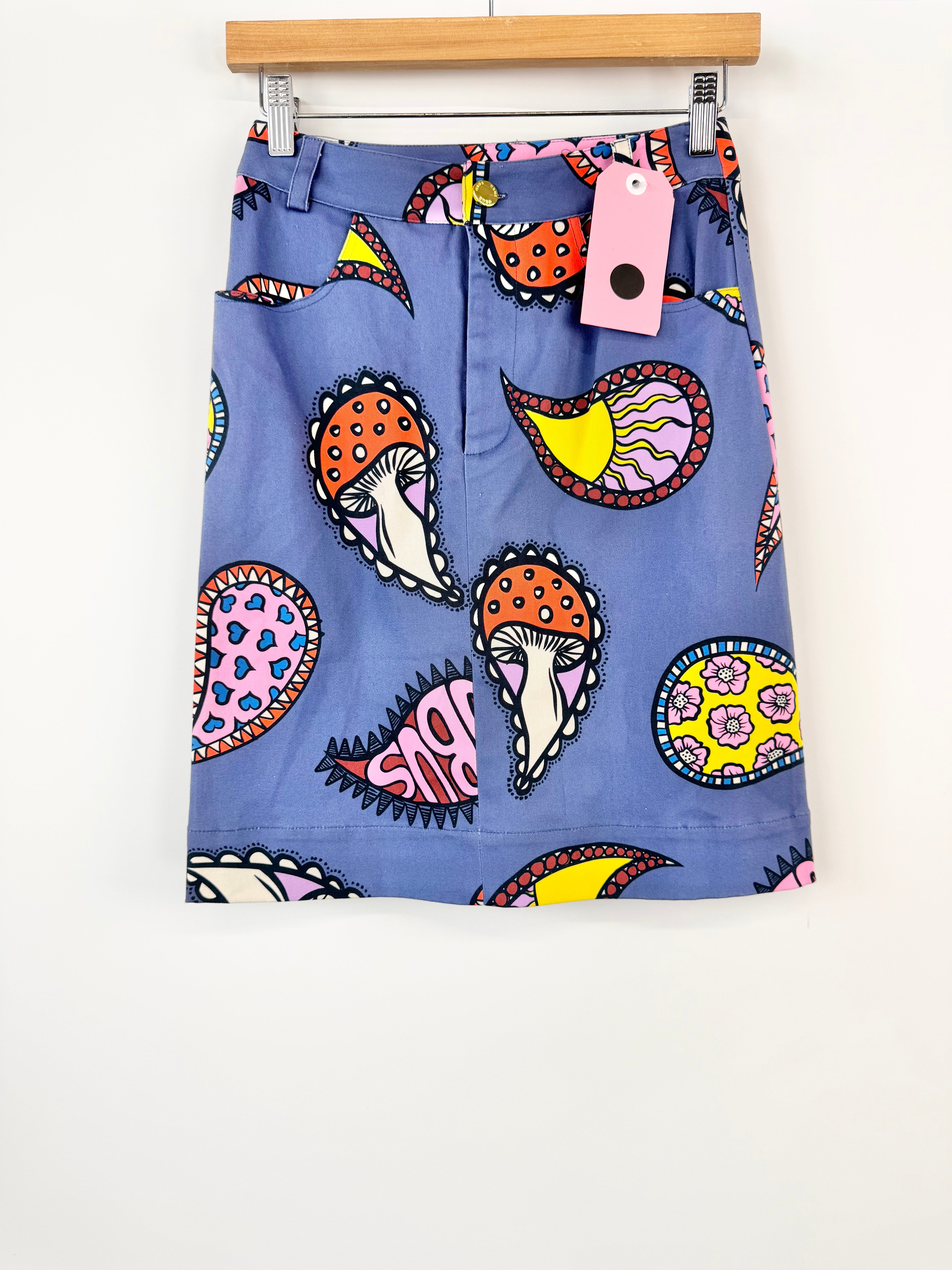 Blue skirt with colorful mushroom pattern on a white background