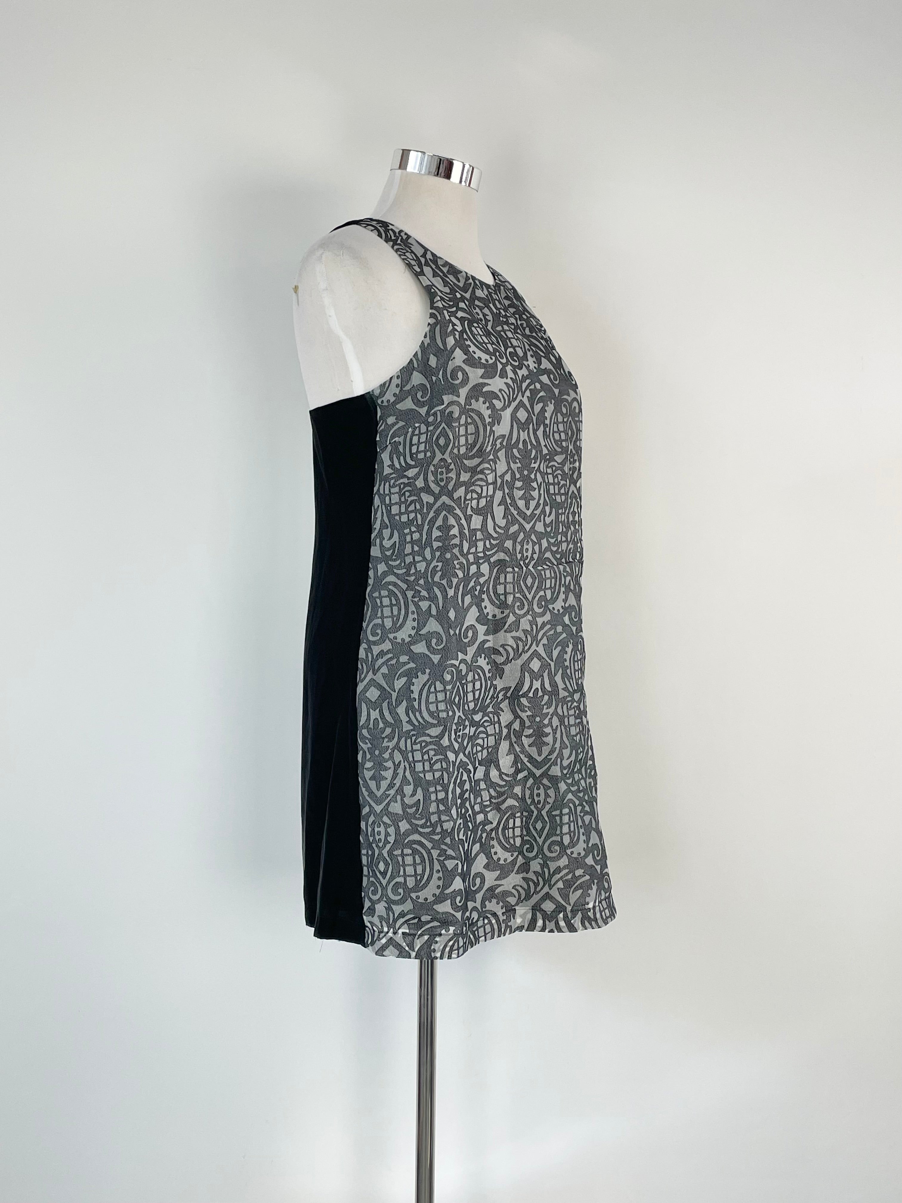Navy blue textured metallic pattern midi dress on a mannequin, showcasing the dress's design and fit.