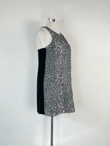 Navy blue textured metallic pattern midi dress on a mannequin, showcasing the dress's design and fit.