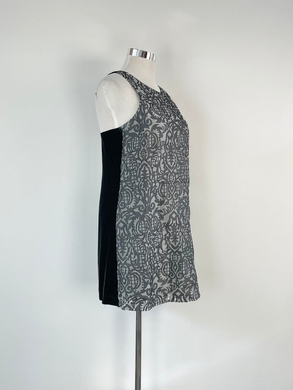 Navy blue textured metallic pattern midi dress on a mannequin, showcasing the dress's design and fit.