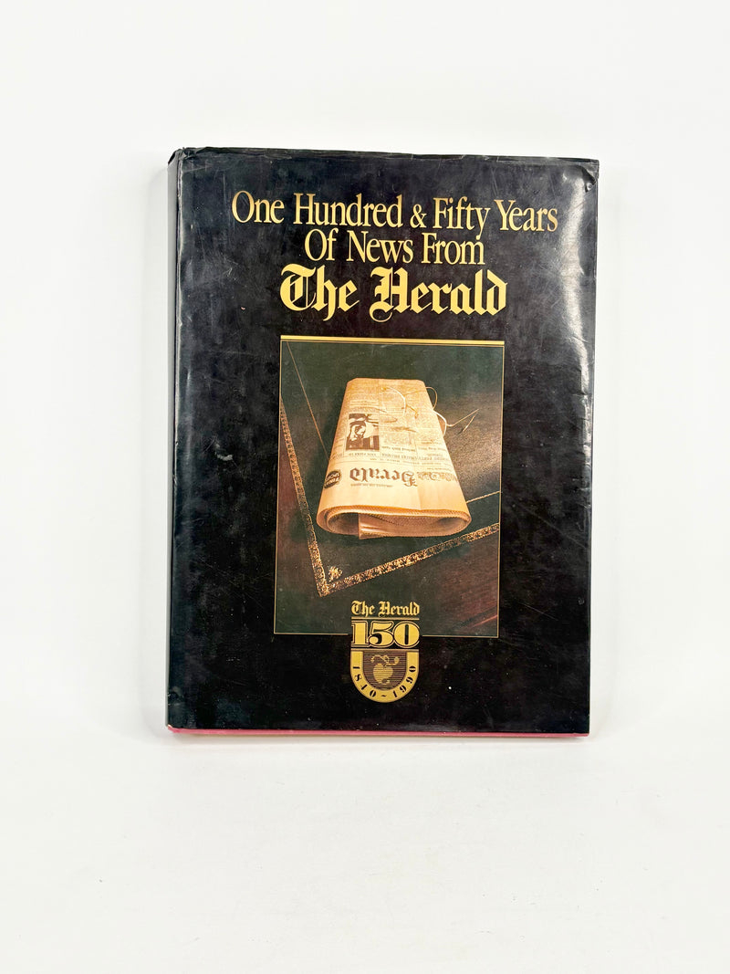 Book cover of 'One Hundred & Fifty Years Of News From The Herald' with a newspaper roll illustration on a white background.