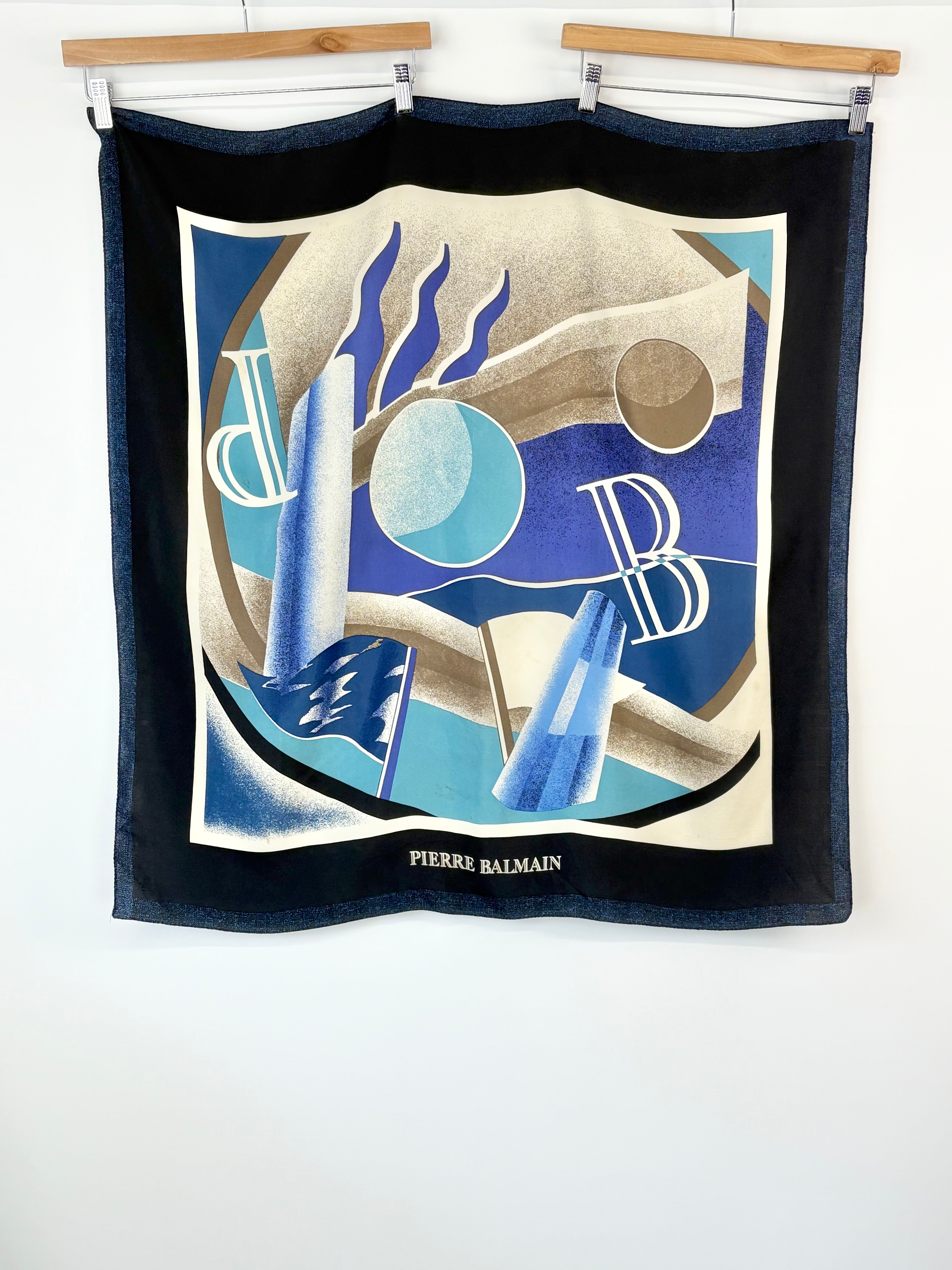 Pierre Balmain scarf with abstract design and brand name on a white background