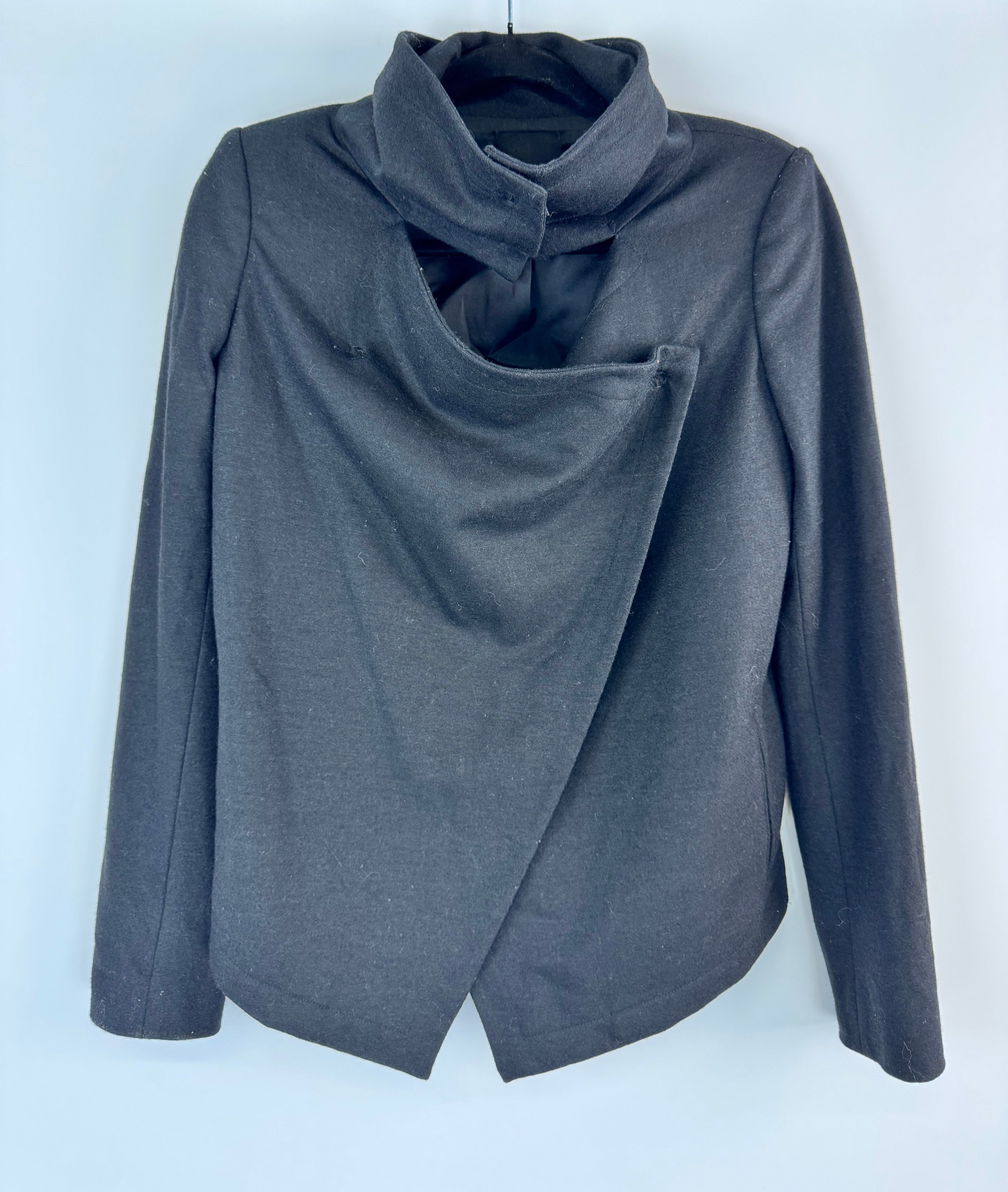 Black wool garment on white background