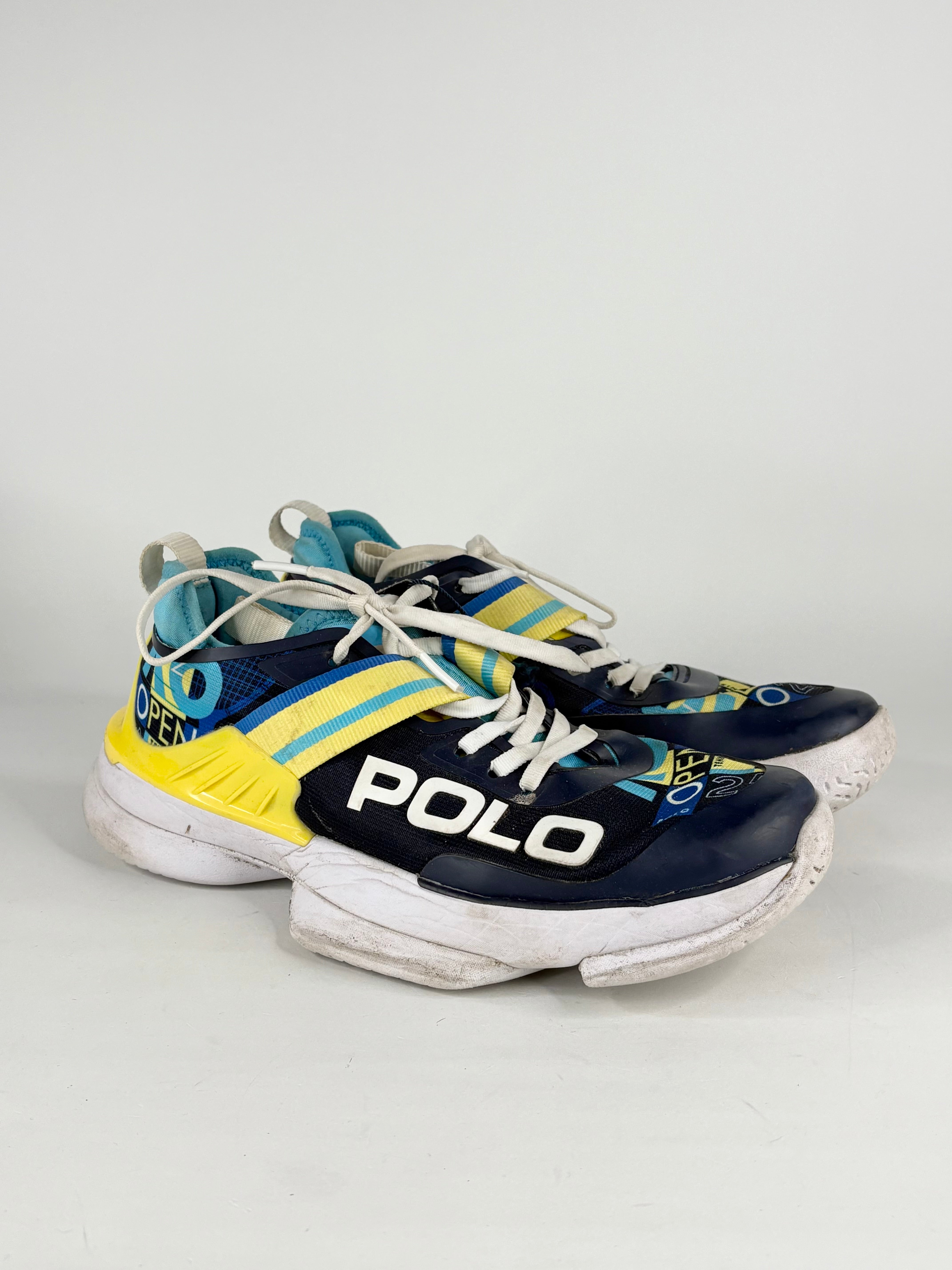 Pair of Polo sneakers with blue, yellow, and white design on a light gray background