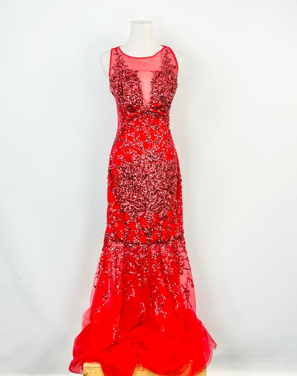 A bright red maxi formal dress with sequin and bead embellishments on the bodice, an illusion neckline, and a flared skirt on a mannequin.