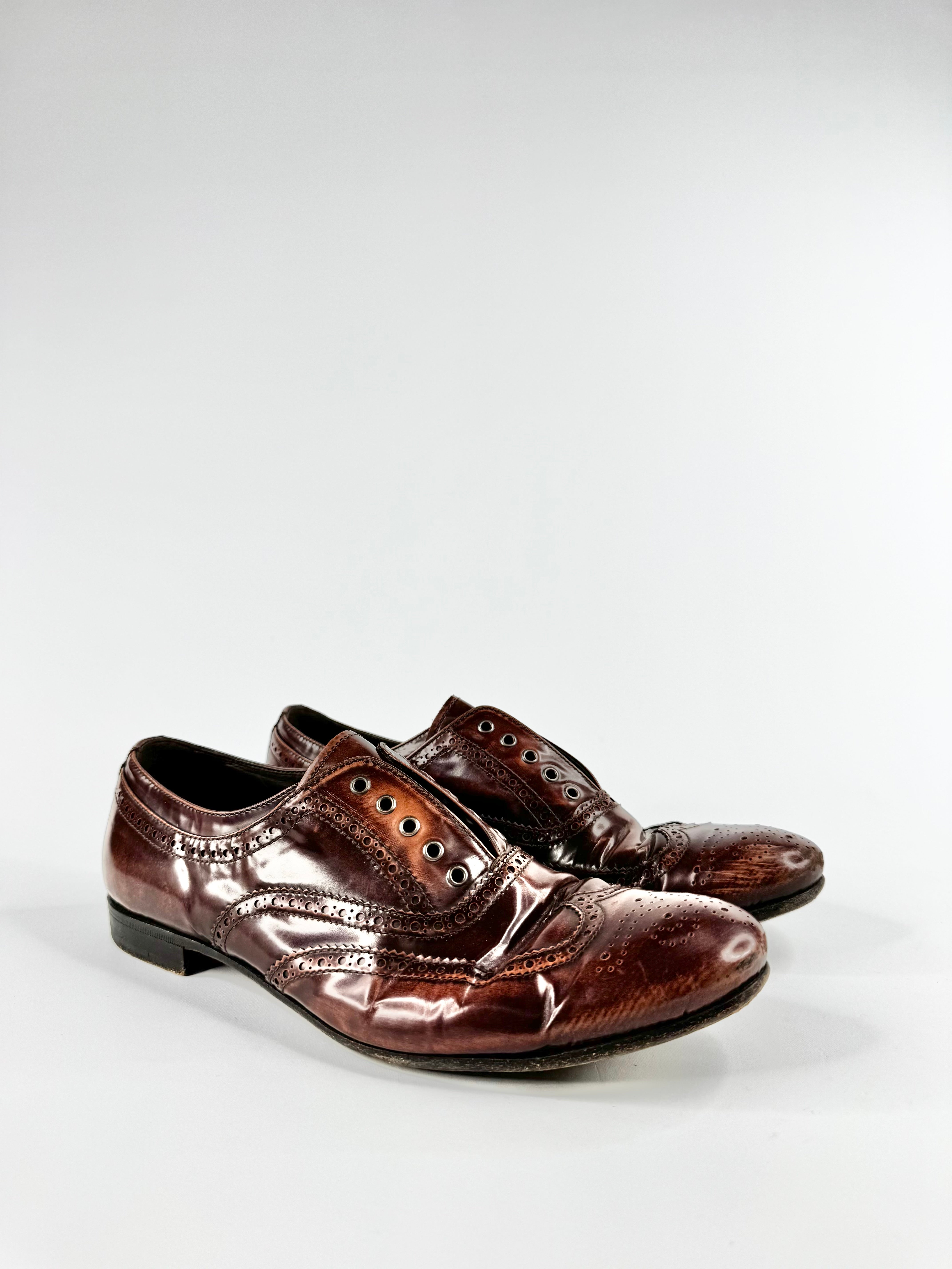 Pair of brown leather shoes on a white background