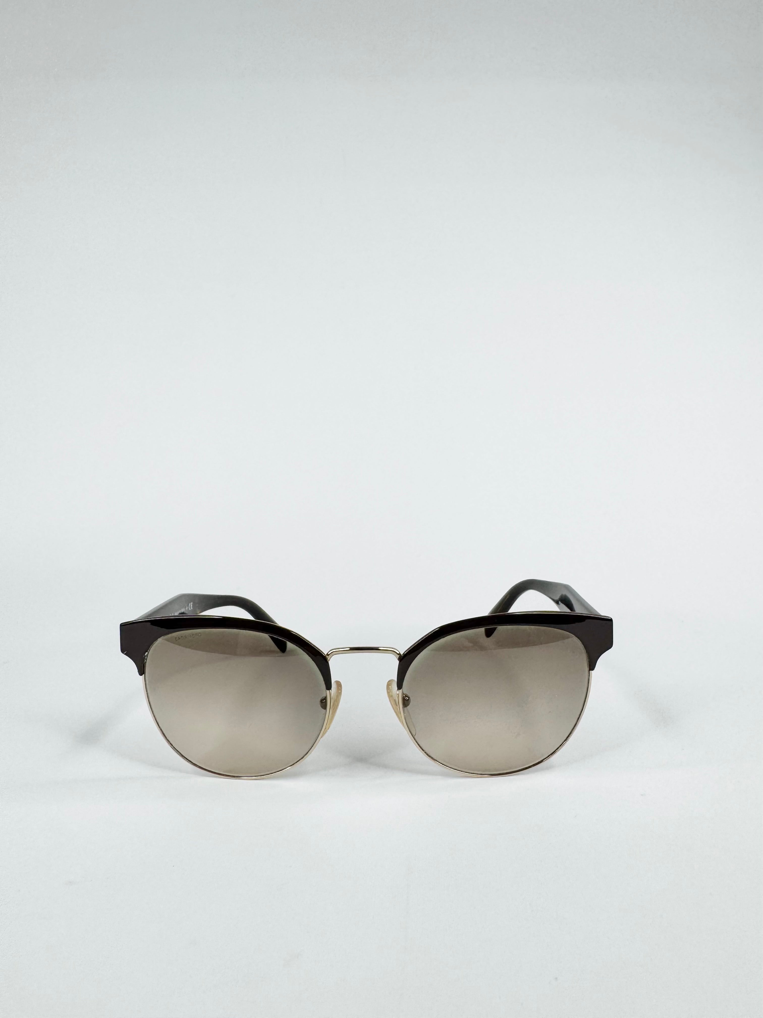 Sunglasses with black frame and reflective lenses on a white background