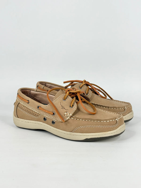 Pair of tan leather shoes with brown laces on a white background