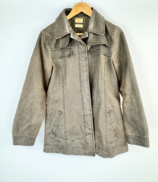 Brown jacket on a hanger against a white background
