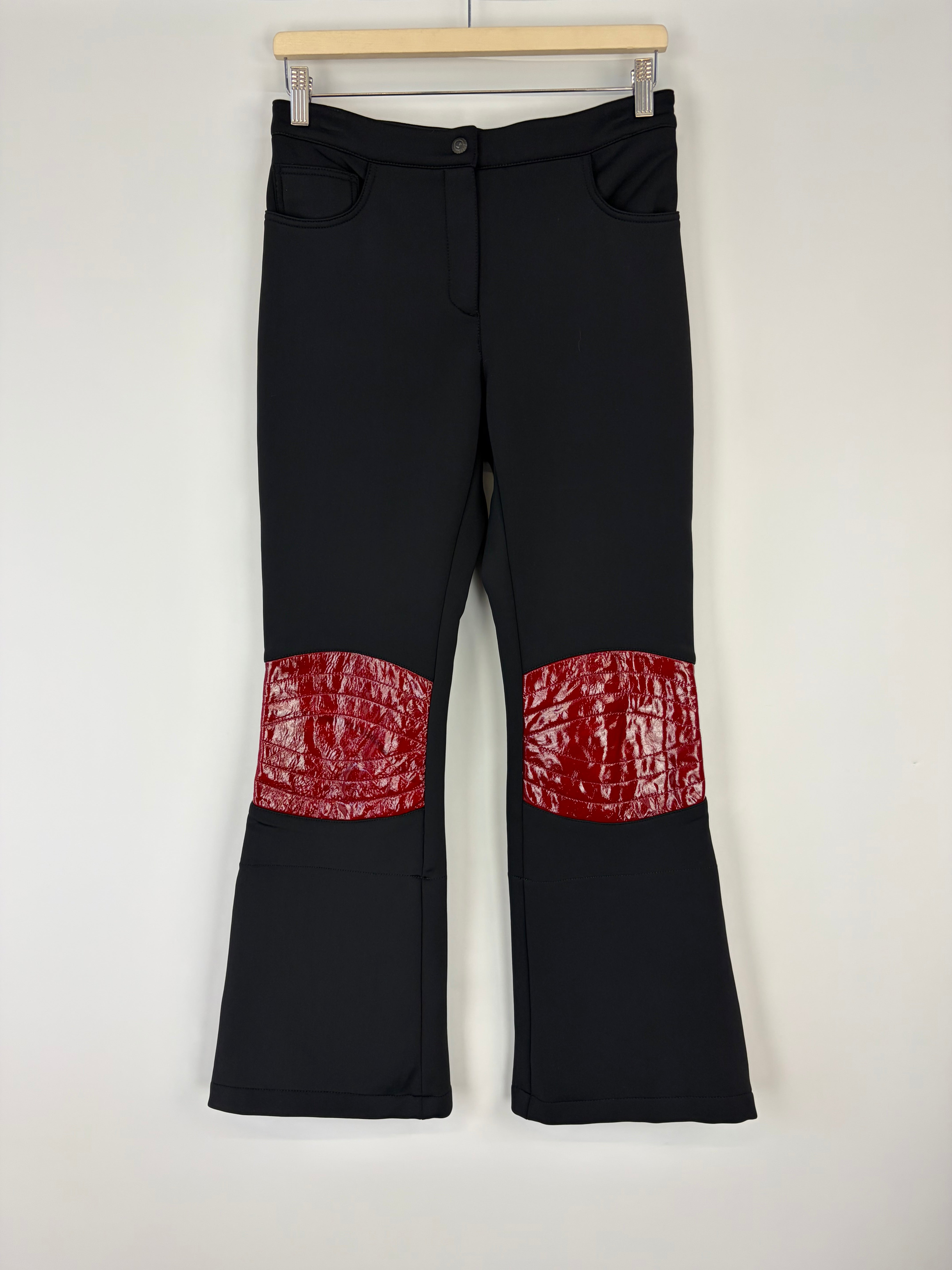 Black pants with red pattern on a white background