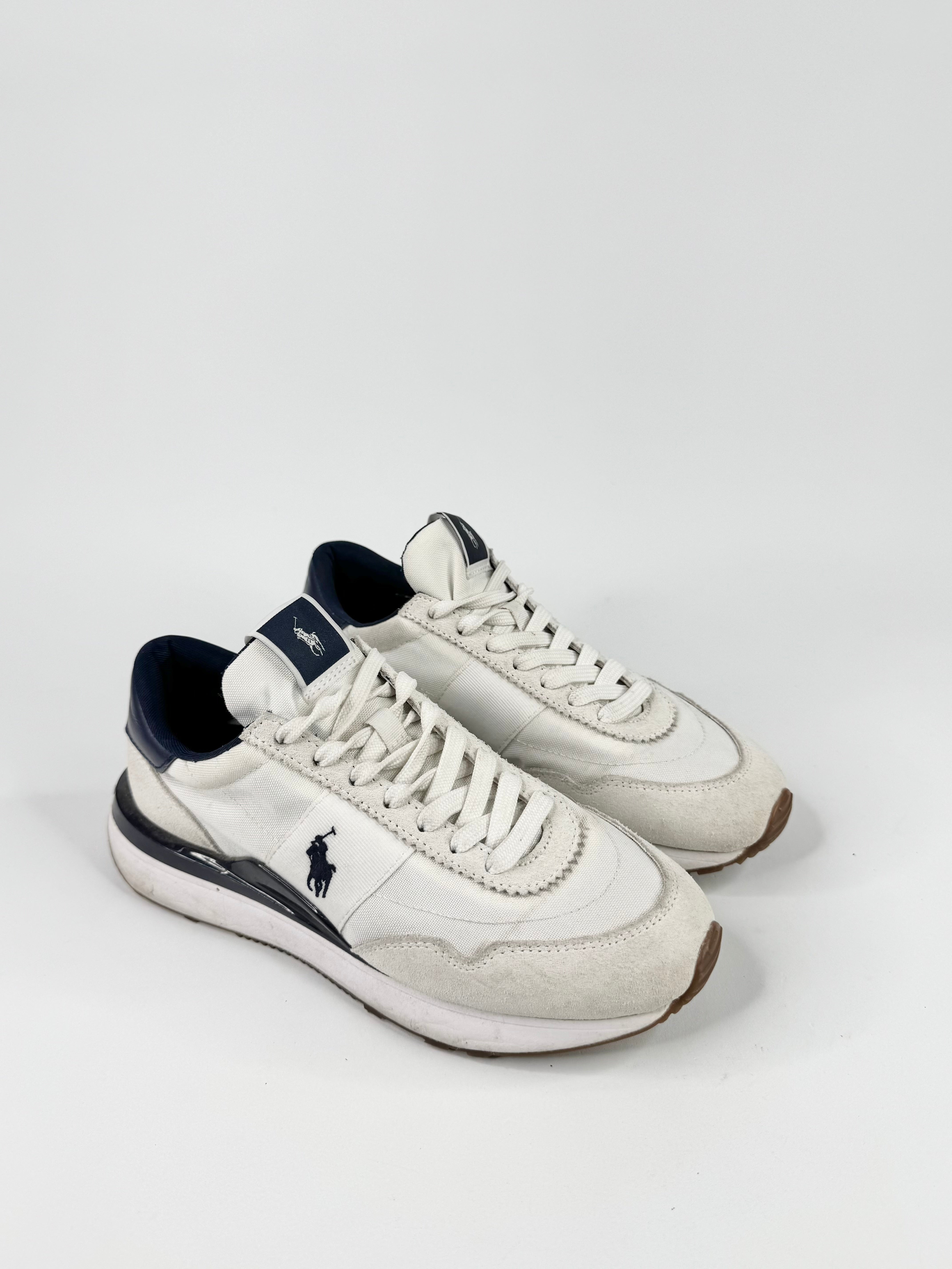 White sneakers with a logo on a white background