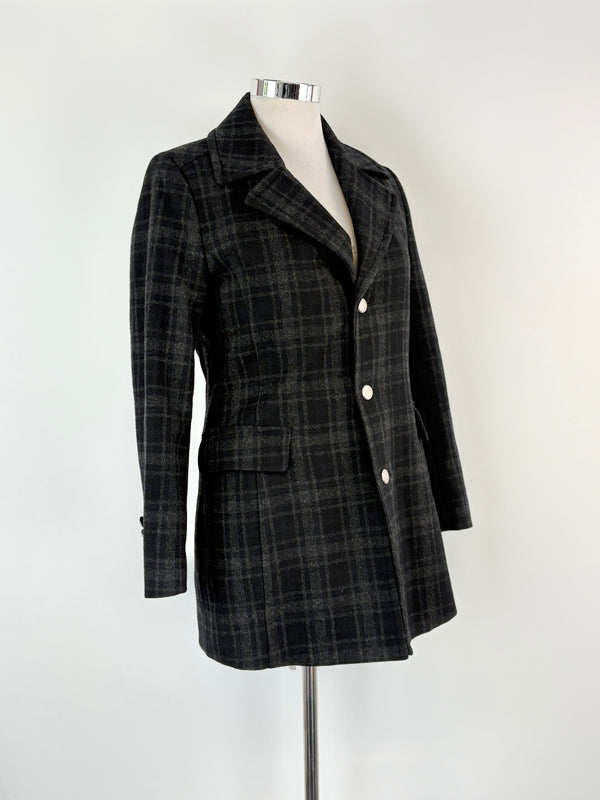 Plaid jacket on a mannequin against a white background