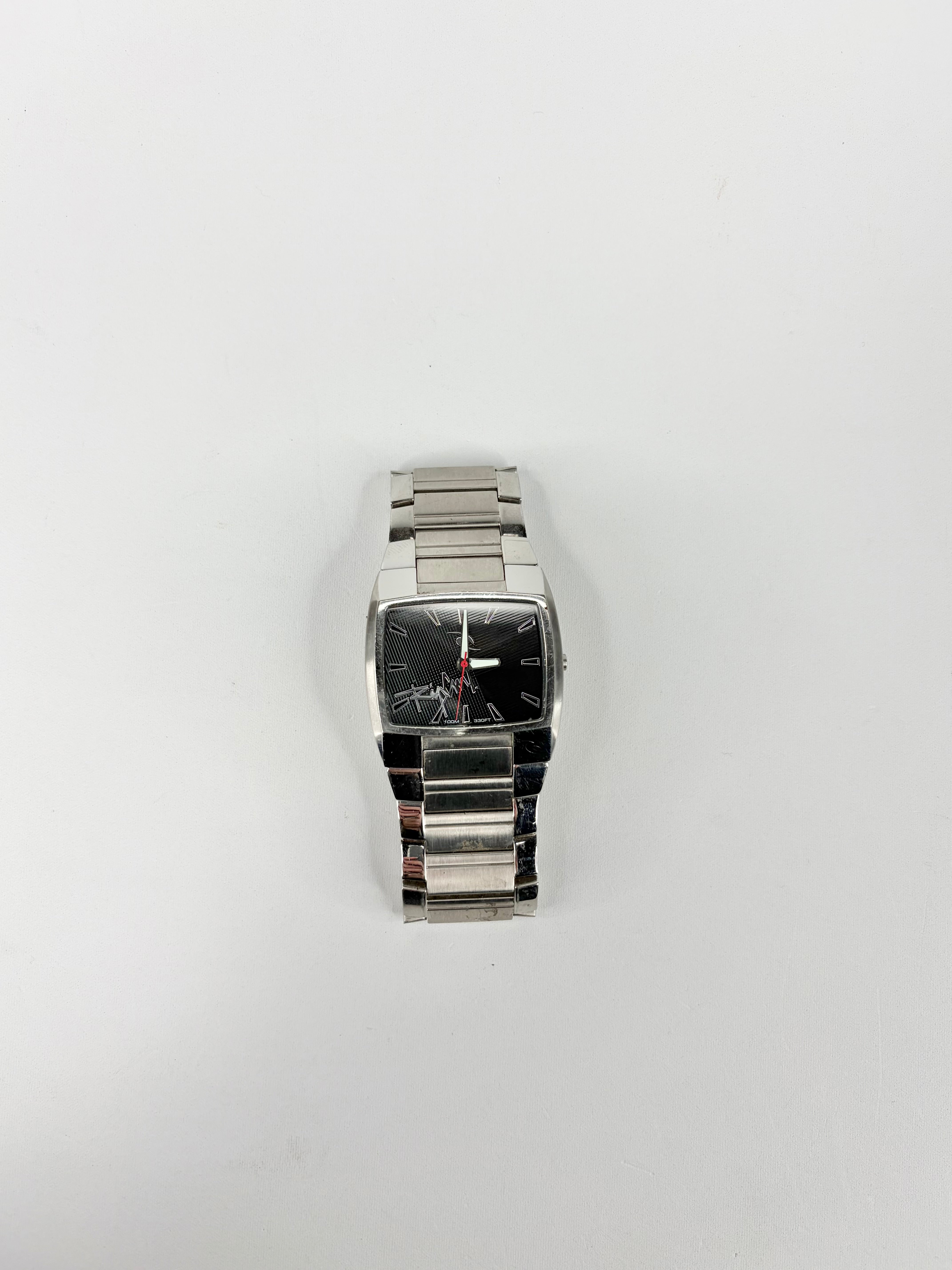 Silver wristwatch on a white background