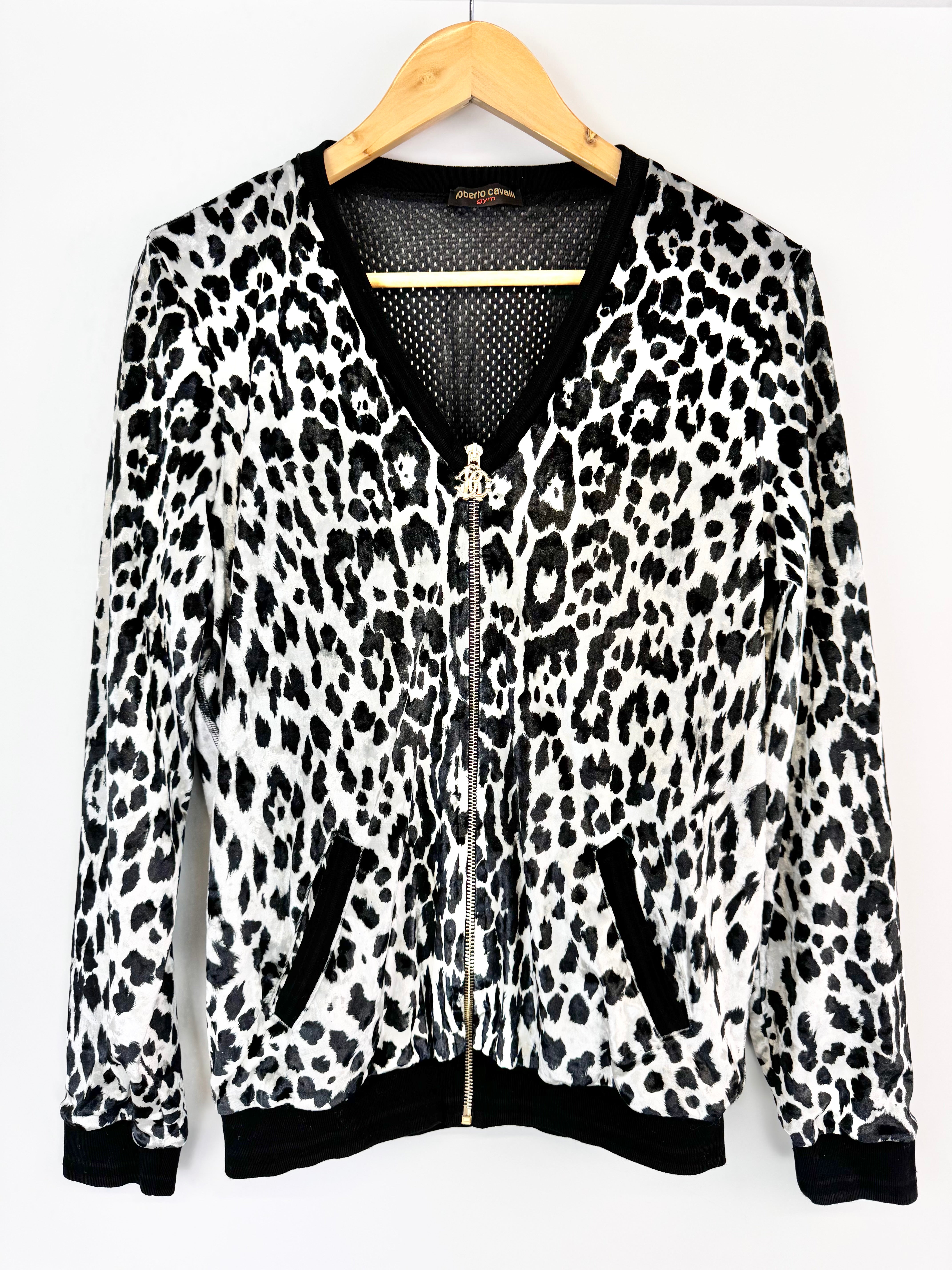 Leopard print jacket on a hanger with a white background
