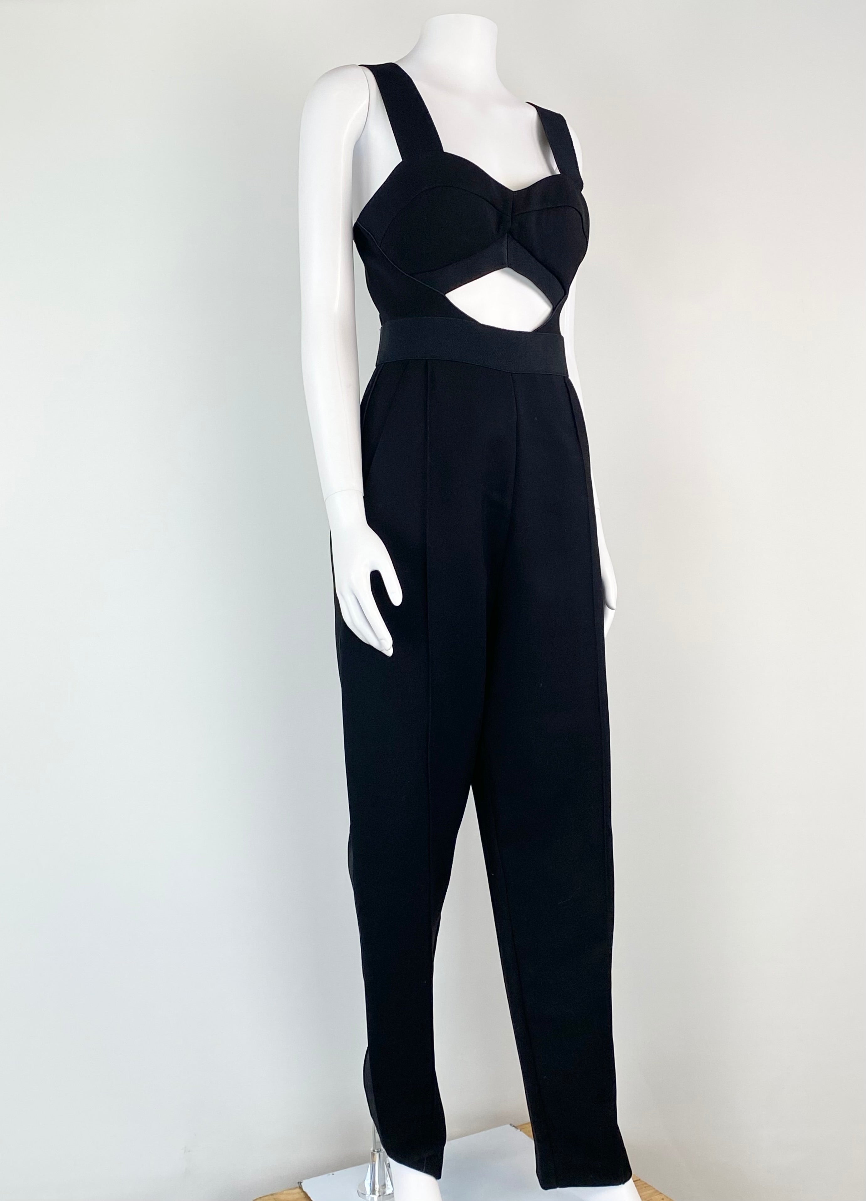 Black jumpsuit on a mannequin against a white background