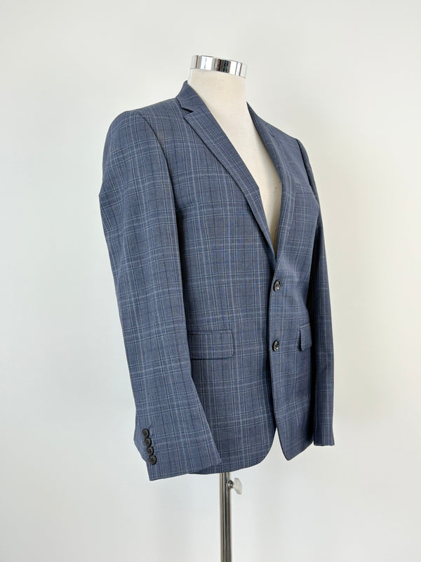 Navy blue check wool-blend jacket on a mannequin, displaying the side profile of the jacket with two visible buttons and a notched lapel.