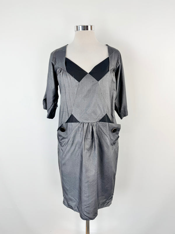 Grey dress on a mannequin against a white background