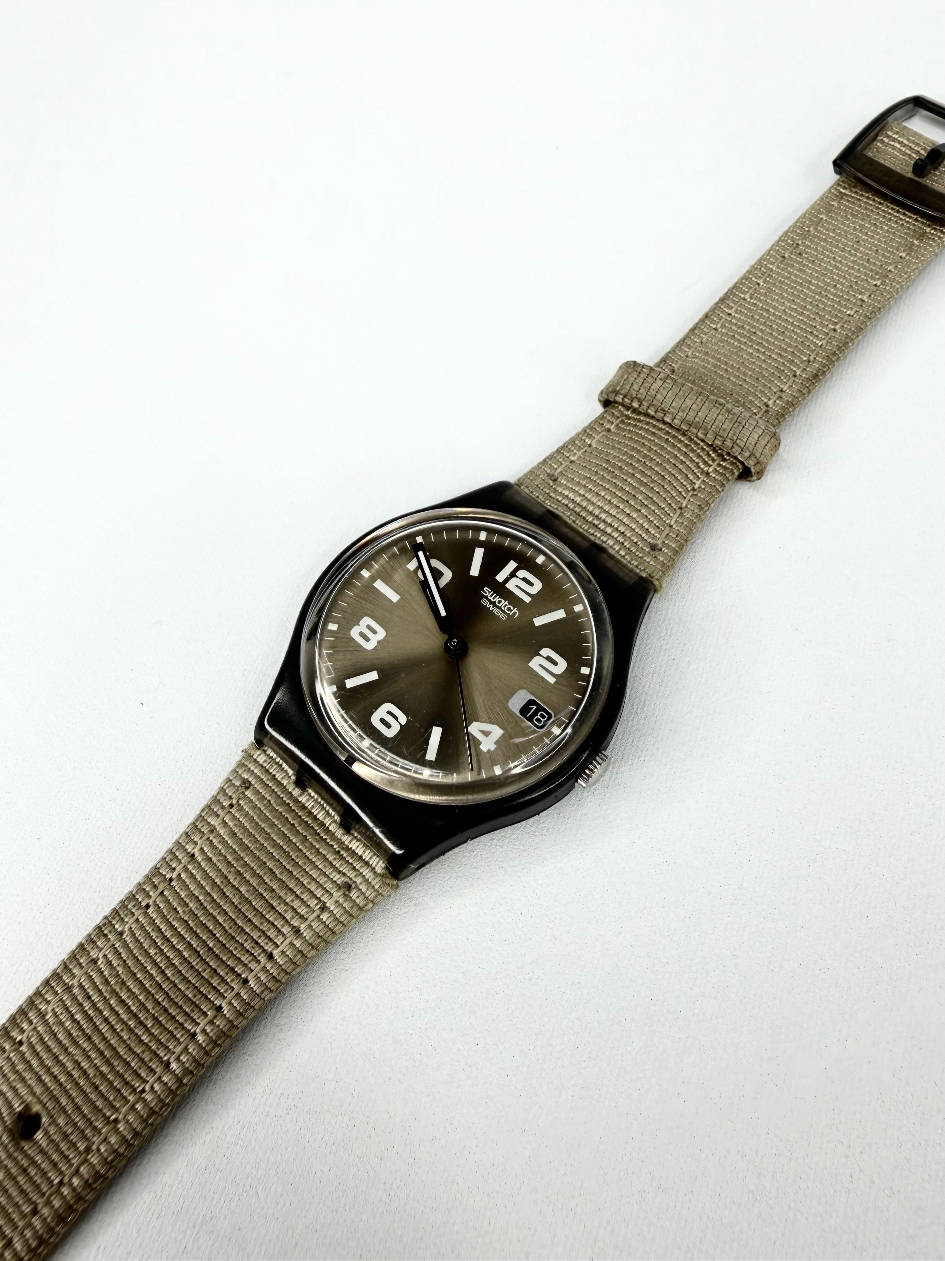 Watch with a brown strap on a white background