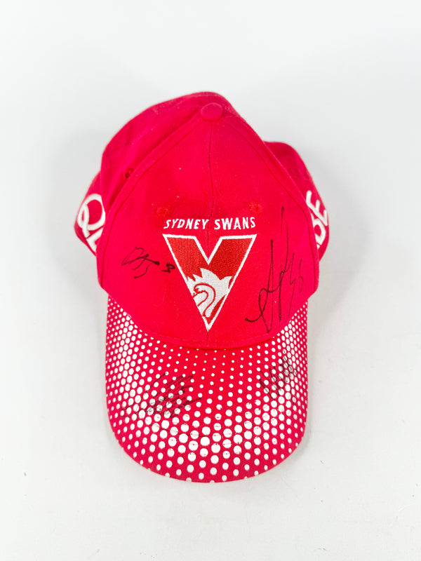 Red cap with 'Sydney Swans' logo on a white background