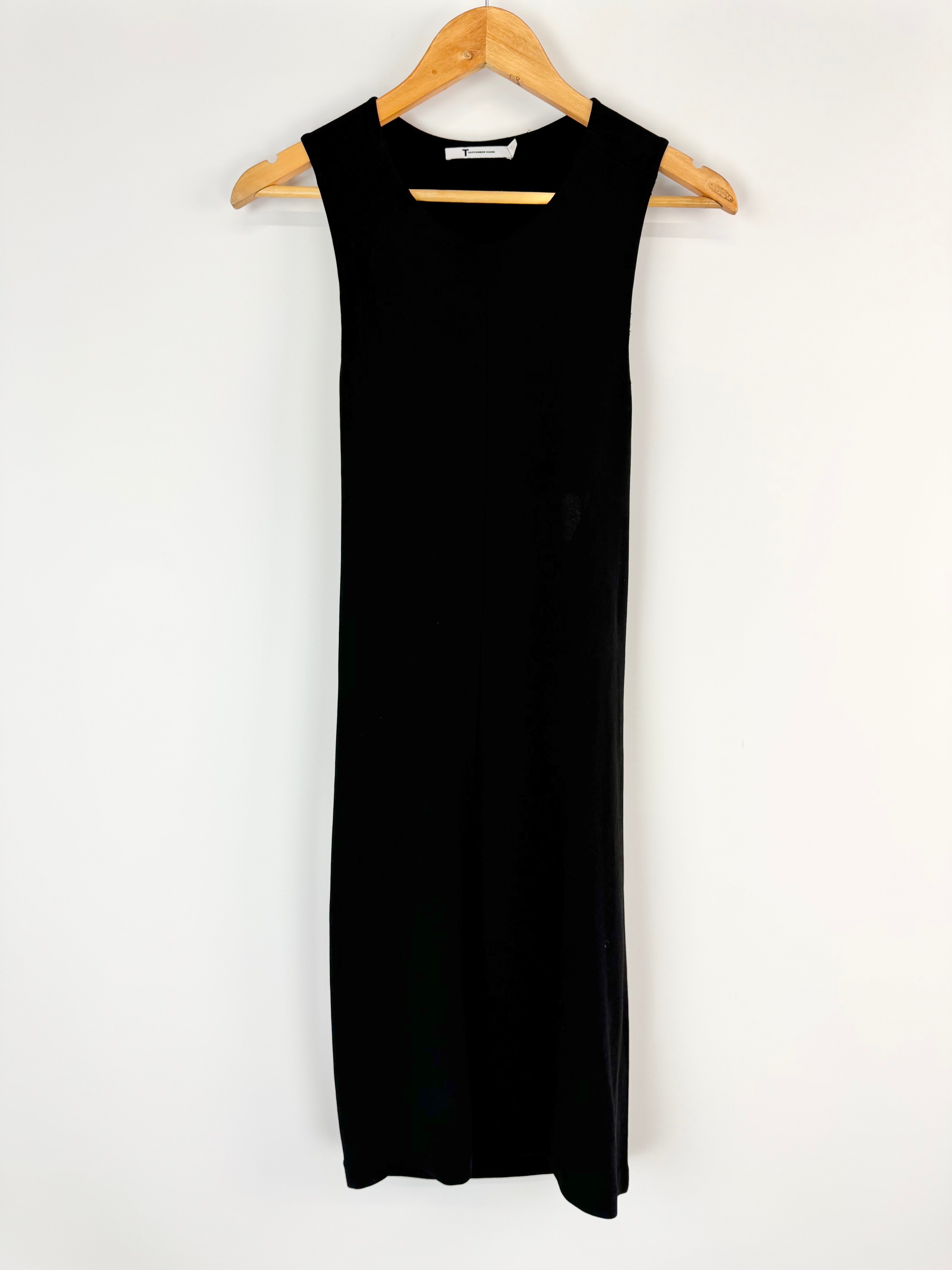 Black sleeveless dress on a wooden hanger against a white background