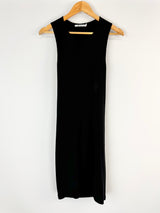 Black sleeveless dress on a wooden hanger against a white background
