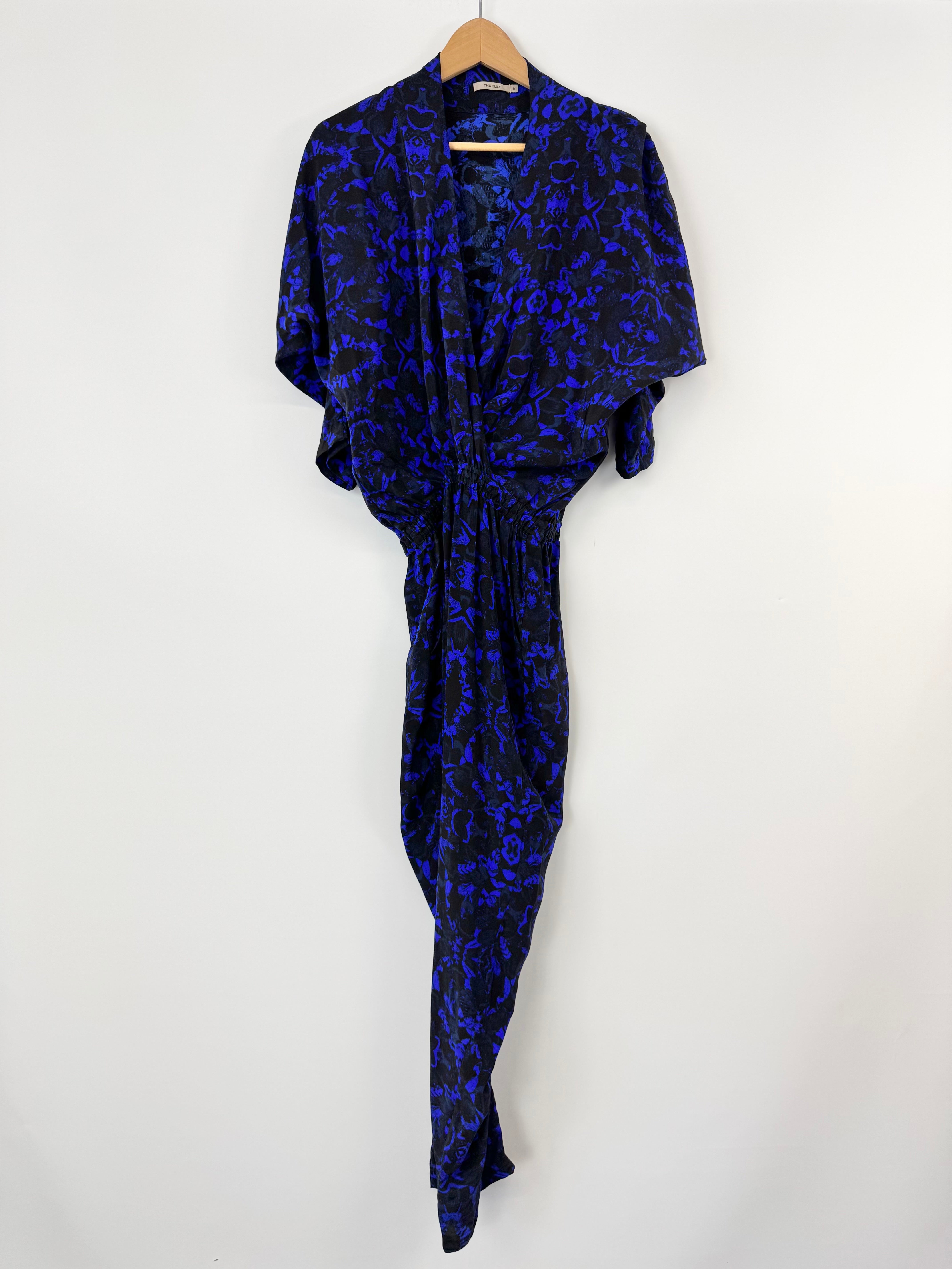Blue and black patterned jumpsuit on a white background