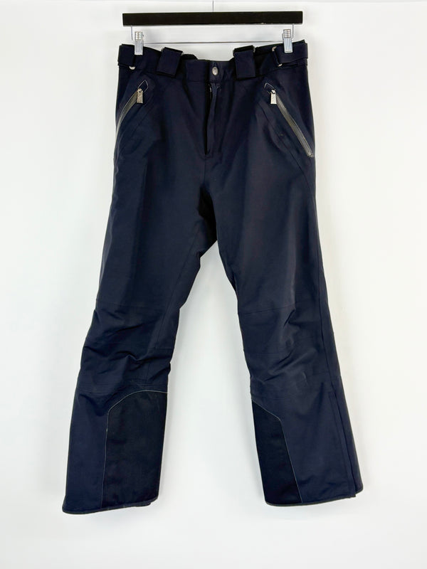 Black snow pants on a white background