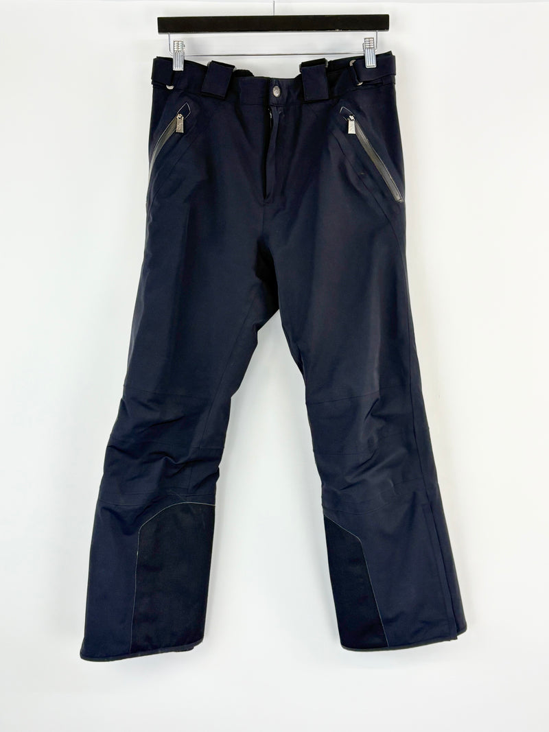 Black snow pants on a white background